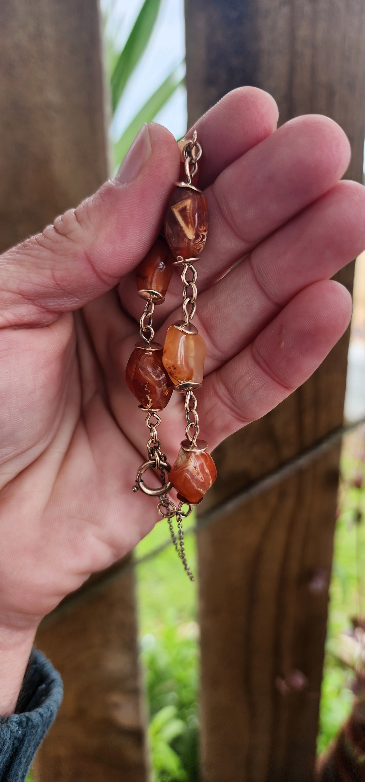 Exquisite Antique Victorian Era 9ct Rosy /Yellow Gold and Banded Carnelian(Agate) Gemstone beaded bracelet with safety chain .
The beads hand wrapped with 9ct Rosy/Yellow Gold wire and accented with 9ct Rose Gold discks at each end of the beads.