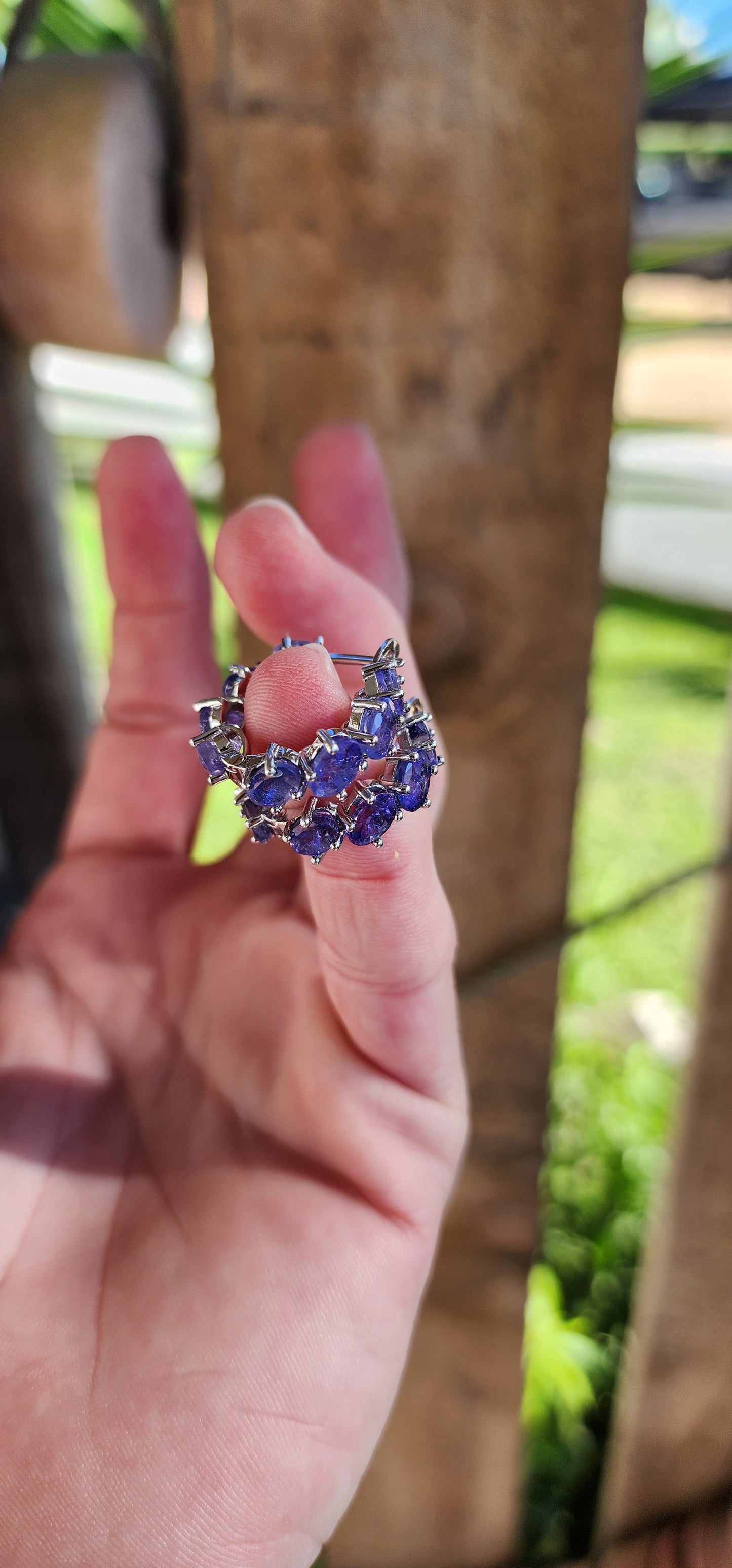 Marvelous pair of Sterling Silver and Tanzanite Gemstones Huggie/Hoop earrings.Each earring claw set with 8x Oval Faceted Cut Tanzanite Gemstones that goes right around .Classical and perfect for day or night wear !