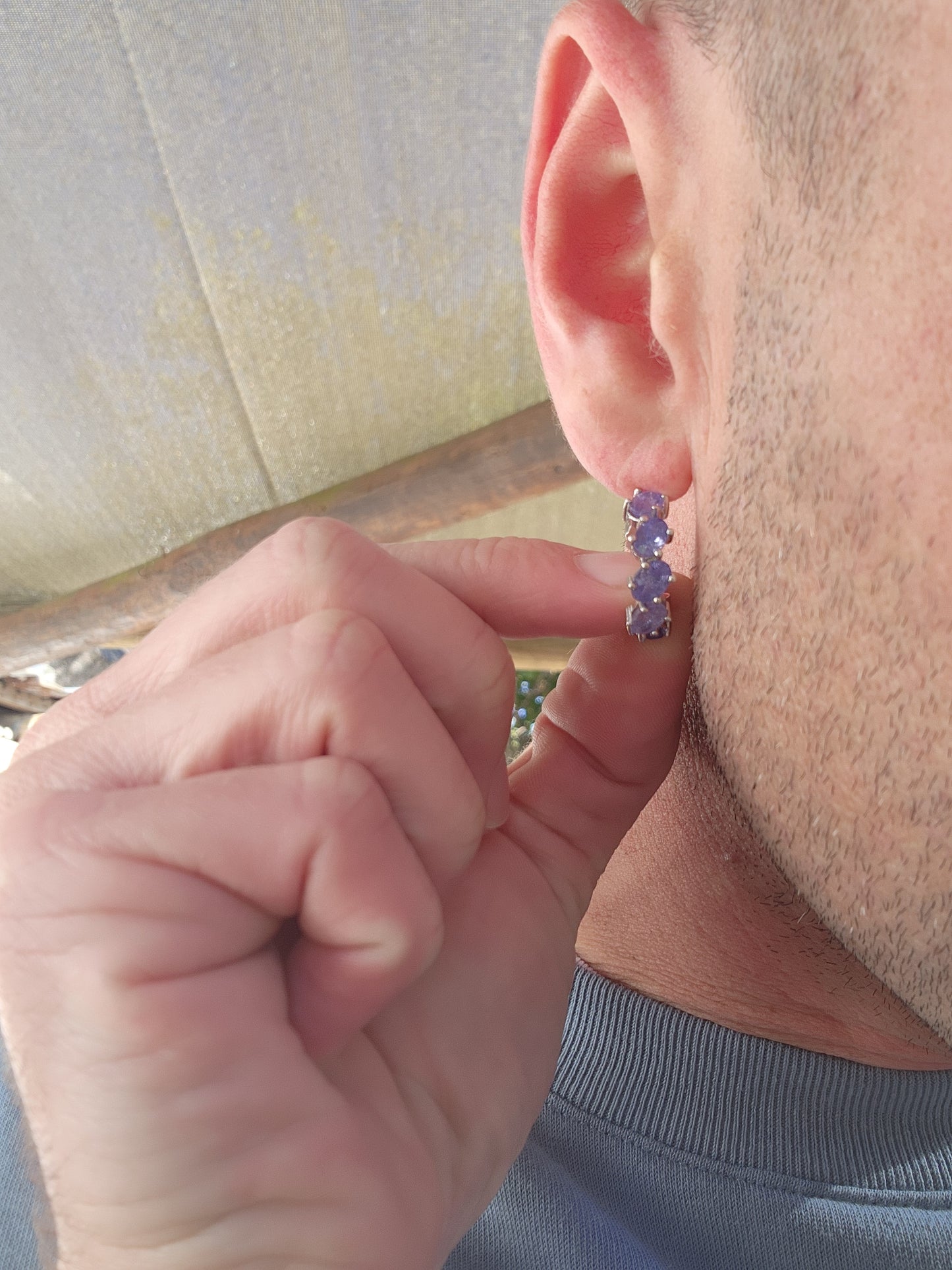 Marvelous pair of Sterling Silver and Tanzanite Gemstones Huggie/Hoop earrings.Each earring claw set with 8x Oval Faceted Cut Tanzanite Gemstones that goes right around .Classical and perfect for day or night wear !