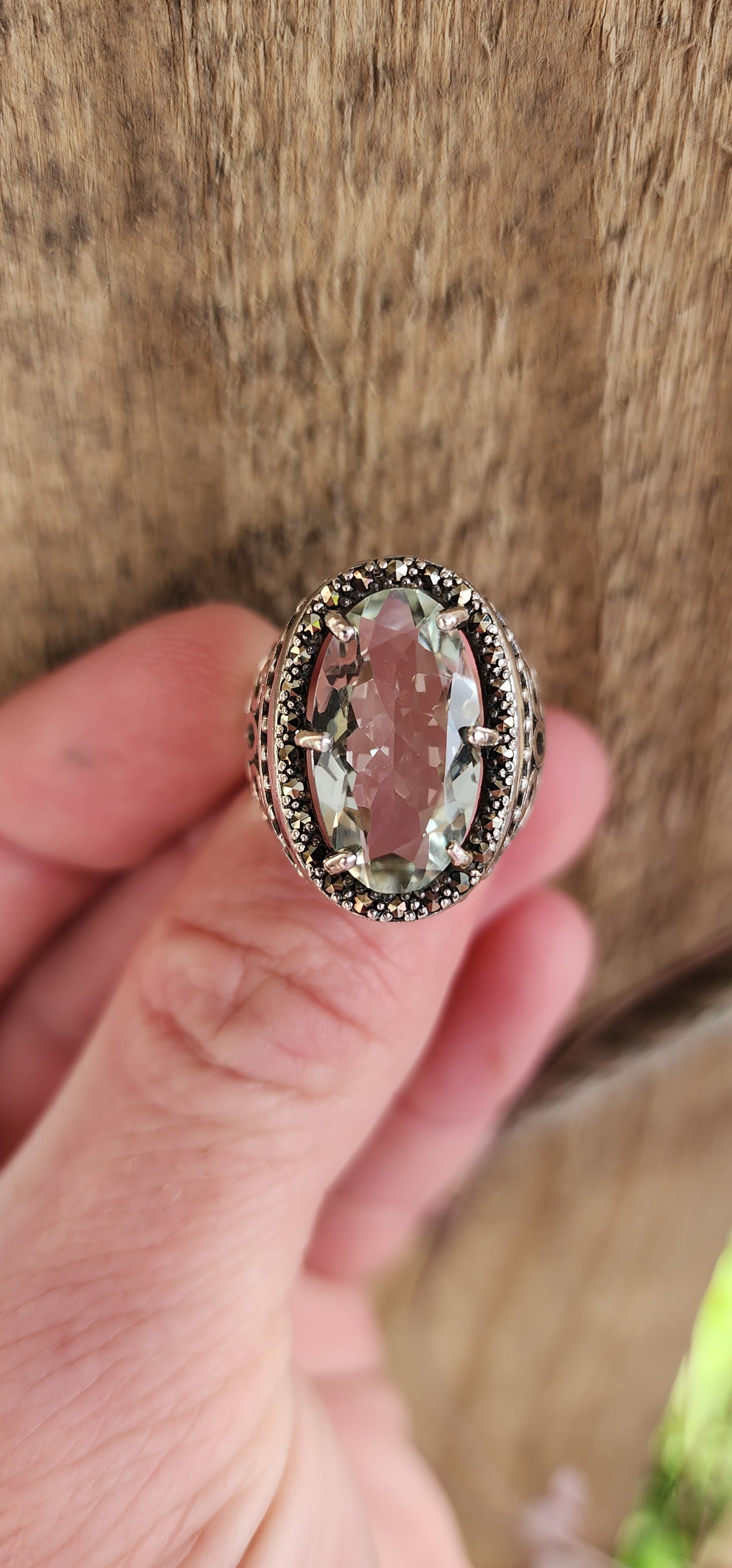 Exquisite and chunky Sterling Silver Cocktail/Dress ring featuring an lovely claw-set light Green Oval Cut Prasiolite Gemstone in an sparkly Marcasite Haló border.