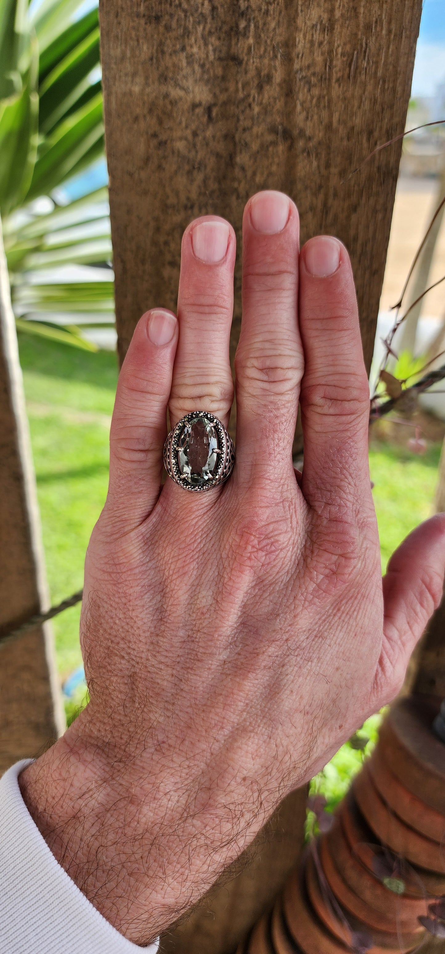 Exquisite and chunky Sterling Silver Cocktail/Dress ring featuring an lovely claw-set light Green Oval Cut Prasiolite Gemstone in an sparkly Marcasite Haló border.