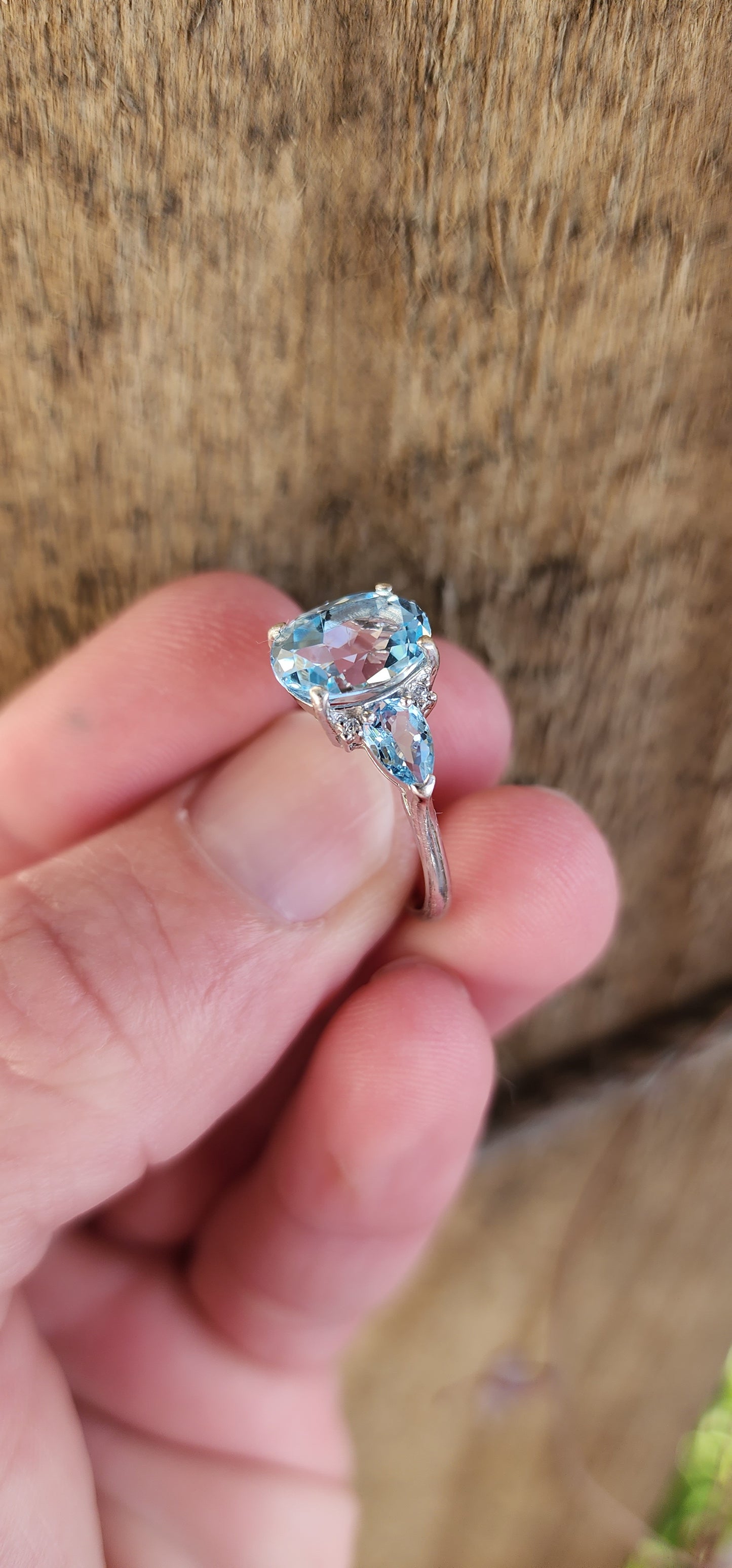 Really beautiful Sterling Silver and Sky Blue Topaz Trilogy ring - Claw set with an centre Oval Cut Topaz Gemstones and flanked by two claw set Pear cut Topaz Gemstones.