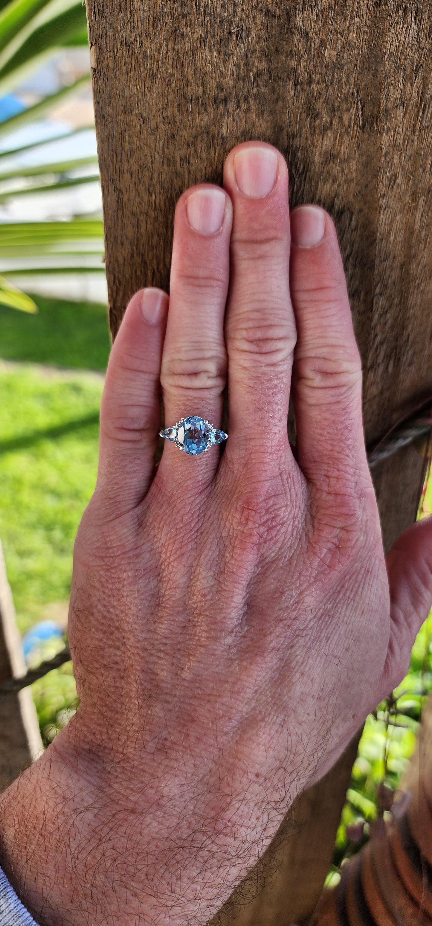 Really beautiful Sterling Silver and Sky Blue Topaz Trilogy ring - Claw set with an centre Oval Cut Topaz Gemstones and flanked by two claw set Pear cut Topaz Gemstones.