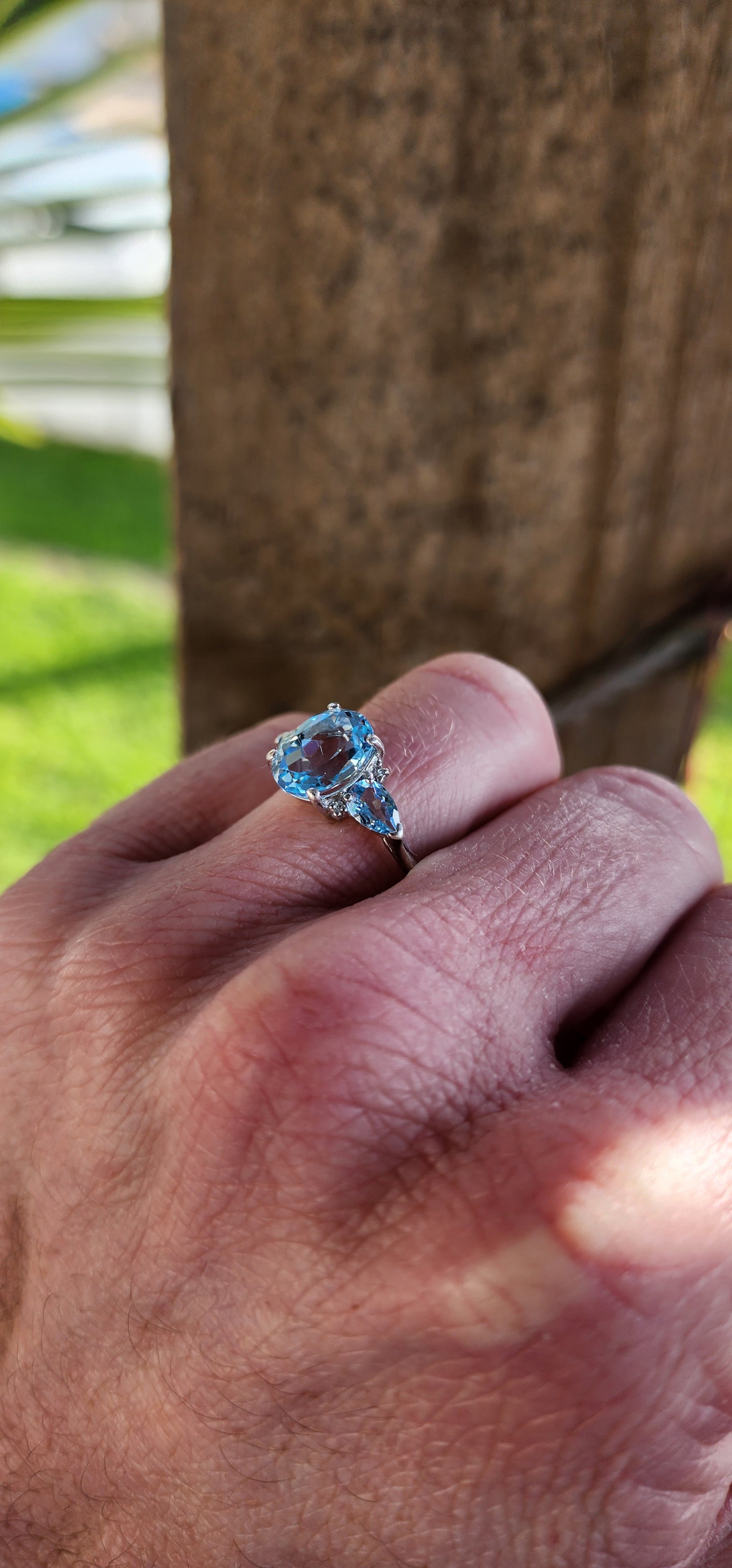 Really beautiful Sterling Silver and Sky Blue Topaz Trilogy ring - Claw set with an centre Oval Cut Topaz Gemstones and flanked by two claw set Pear cut Topaz Gemstones.