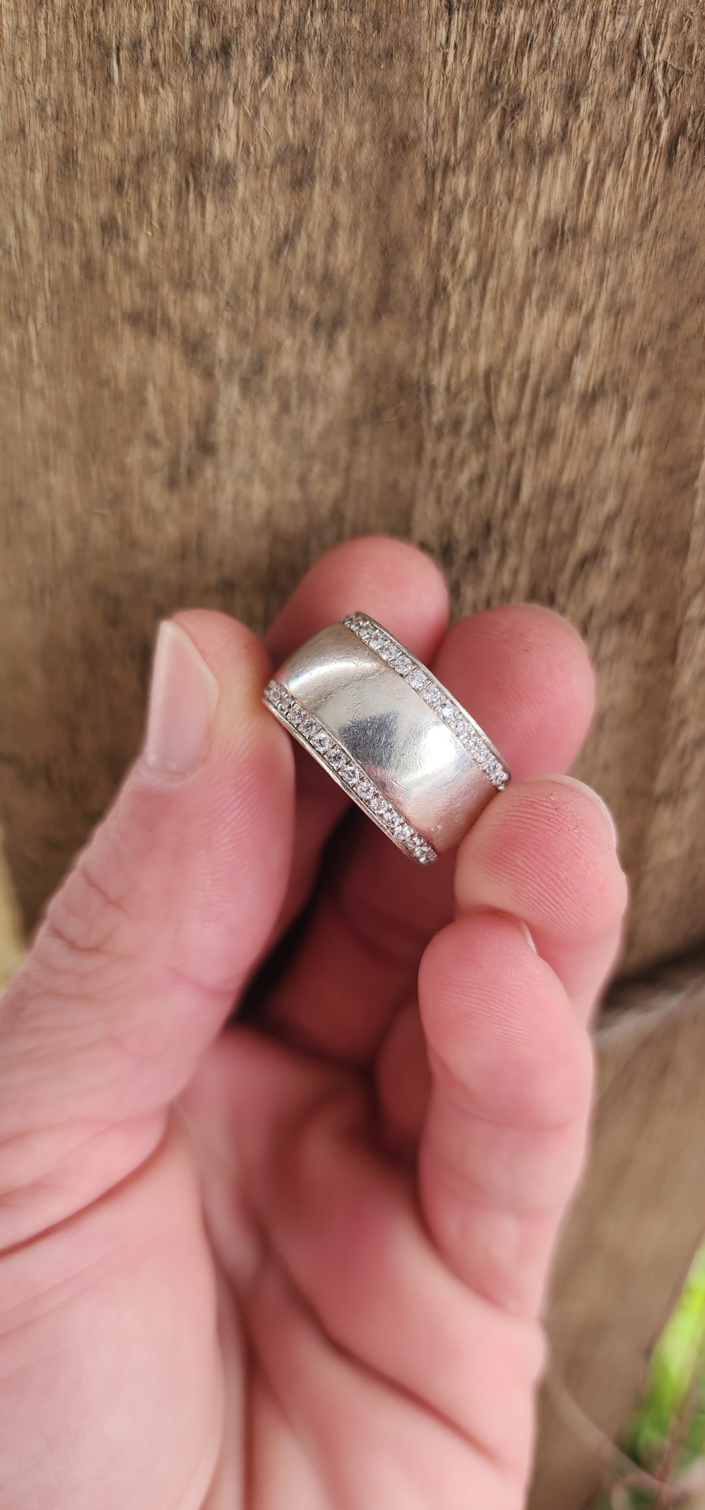 Chunky Sterling Silver unisex eternity style ring featuring two rows of Round cut and bead set CZ Gemstones.