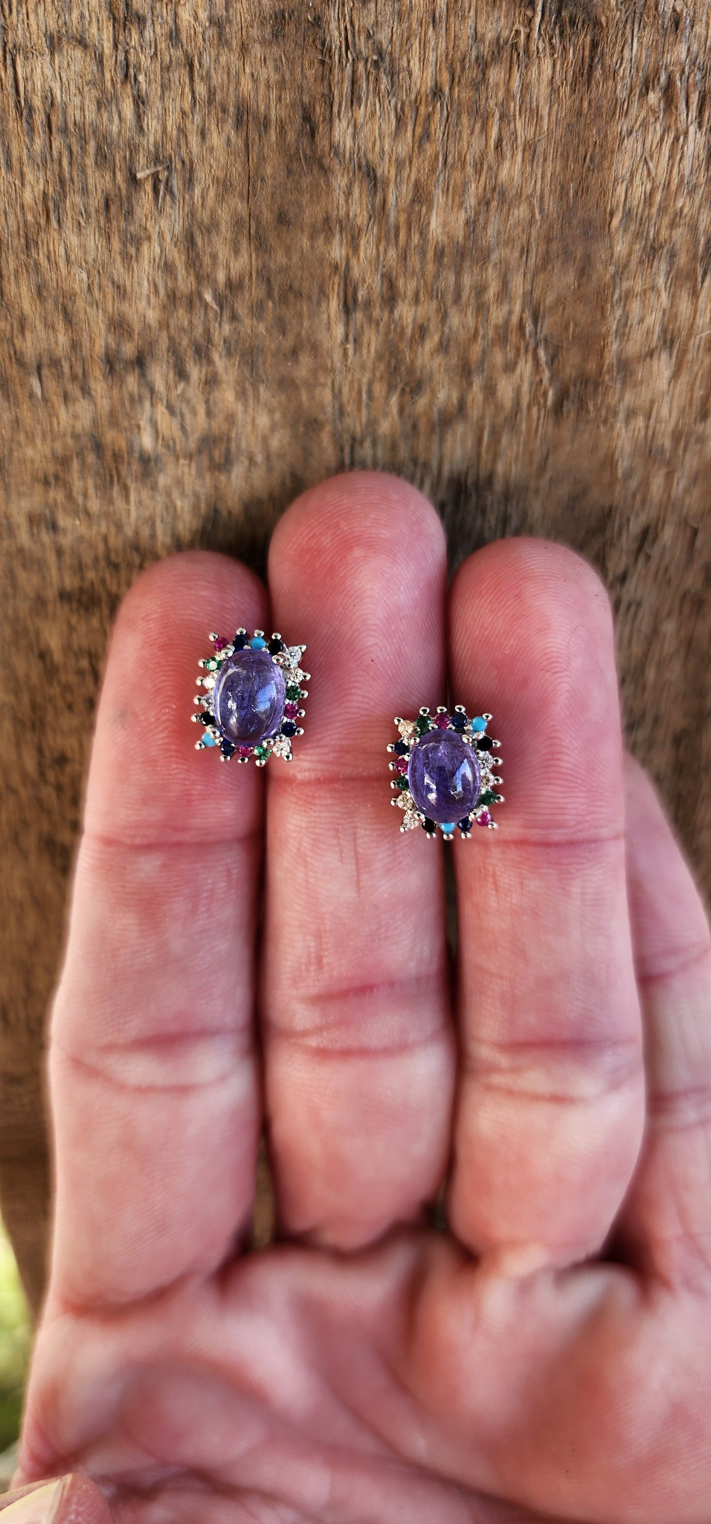 Extremely beautiful and elegant pair of Sterling Silver stud earrings - Each Earring claw set with an Natural Tanzanite Cabochon in the centre and surrounded by an muticolor Gemstones Haló frame.