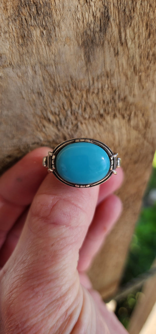 Increbidly beautiful Sterling Silver Artisan made unisex ring , featuring the most beautiful Robins Egg Blue Turquoise Cabochon , claw set in an raised basket with highly ornate shoulders