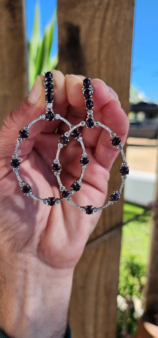 Beautiful and large pair of Sterling Silver statement/drop push-in earrings .Designed in an elegant Oval shape and adorned with multiple Black Ethiopian Opal Cabochons in claw settings and sparkly clear CZ Gemstones.