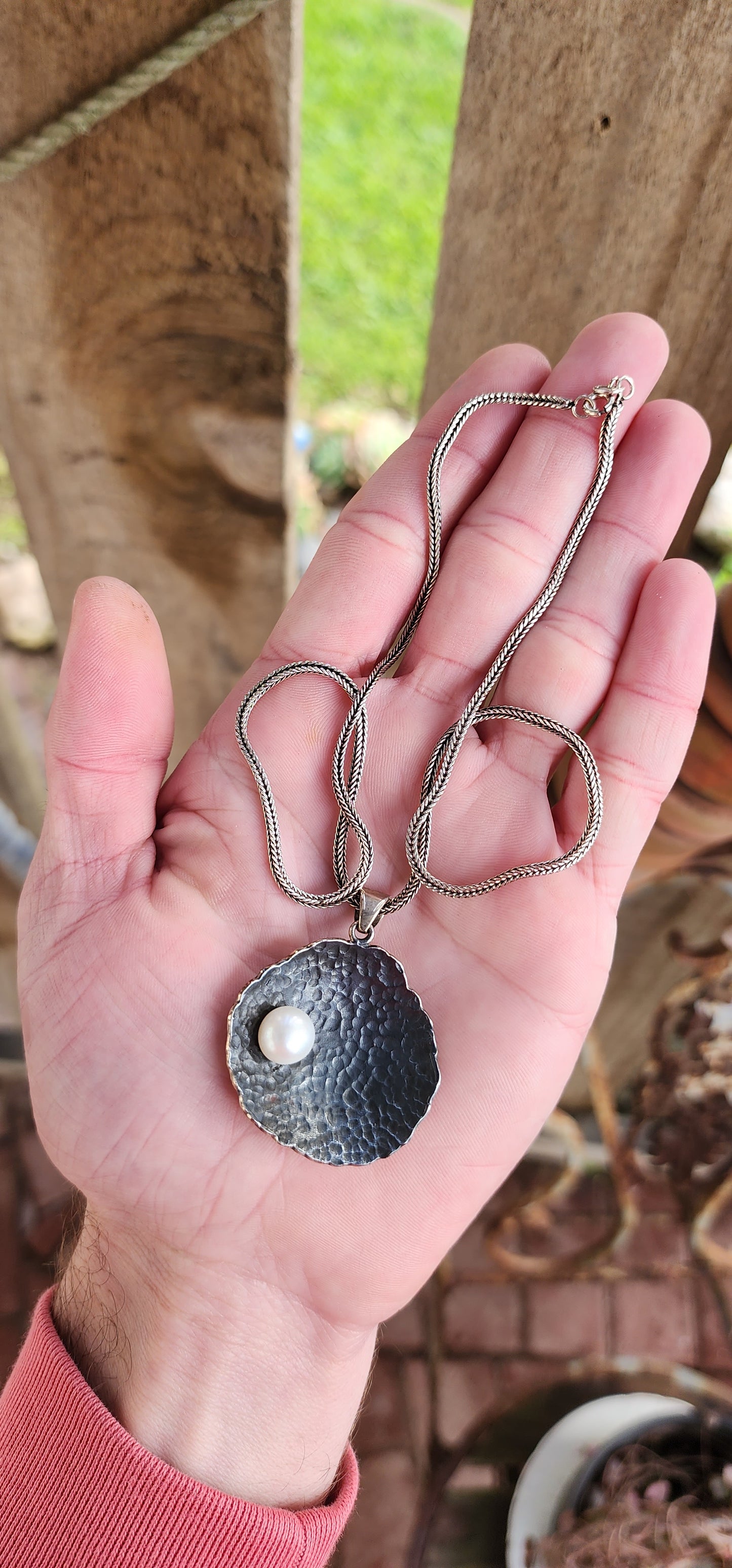 Unusual Artisan/Studio made Sterling Silver Modernist/Brutalist textured/hammered concave Round pendant with an Cultured Pearl , oxidised with an lovely Black patina.Fitted on an Sterling Silver Foxtail chain.