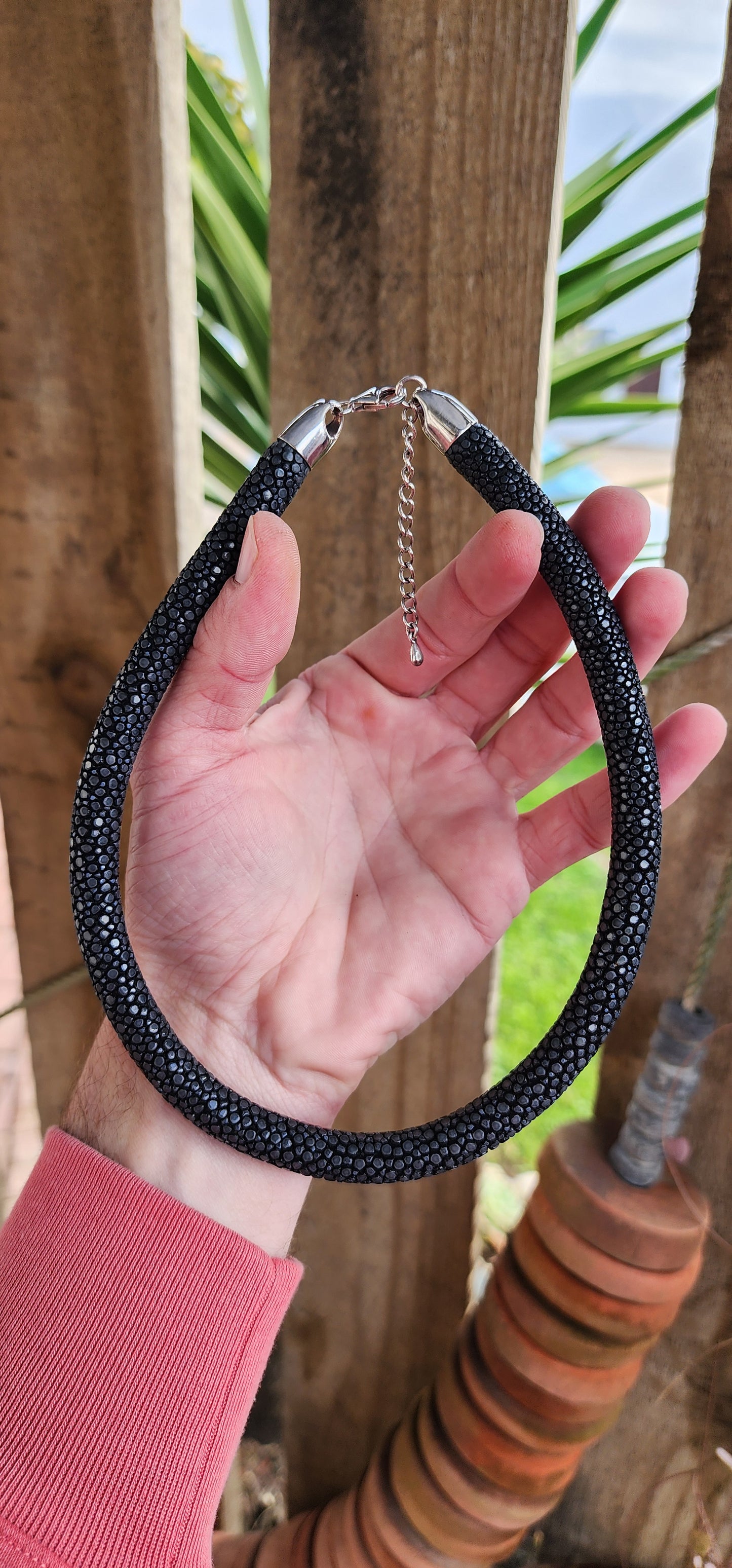 Such an unusual and exotic piece ! Chunky Black Stingray Leather tubed/pipe necklace with Sterling Silver ends and fitted with an Sterling Silver Lobster clasp and adjustable chain.