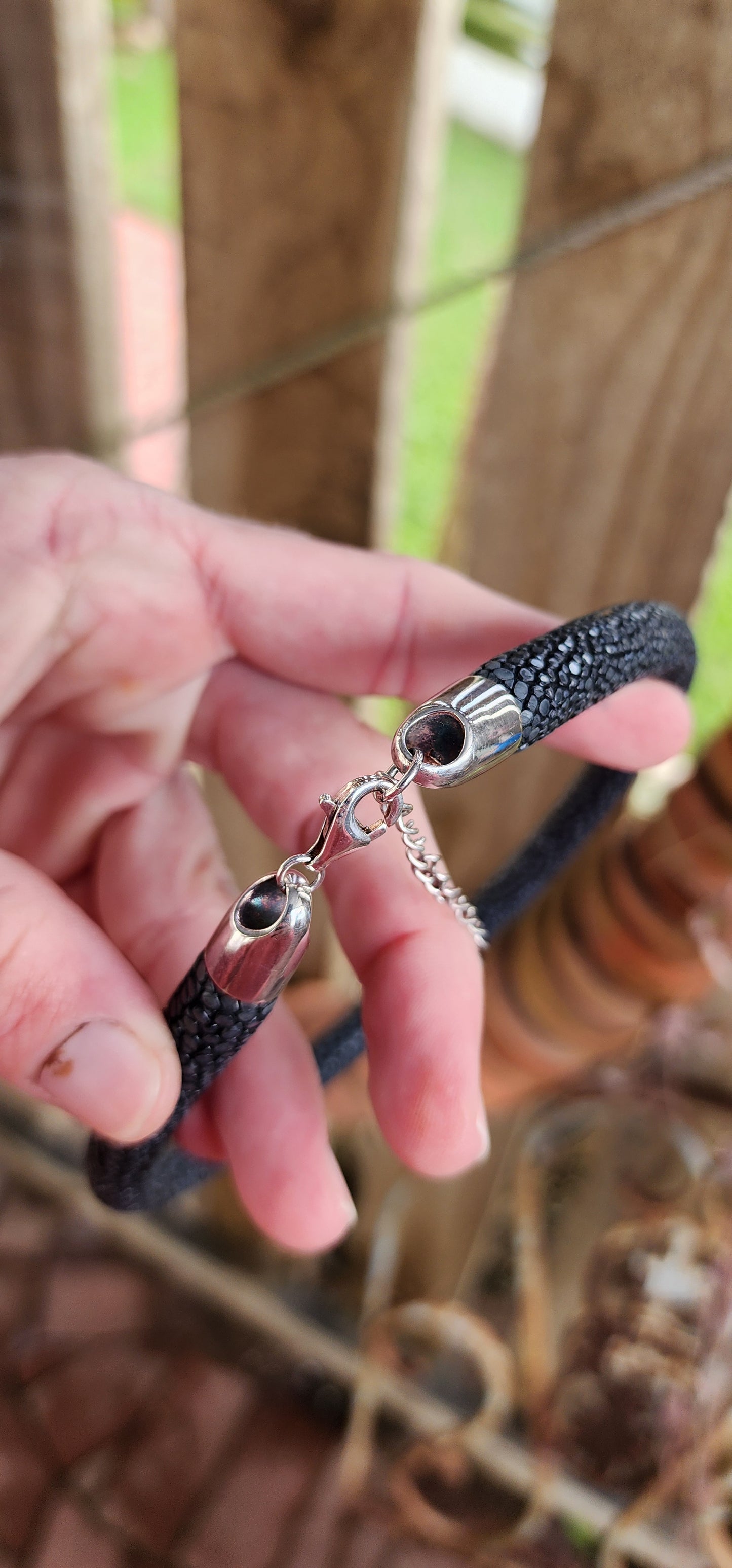 Such an unusual and exotic piece ! Chunky Black Stingray Leather tubed/pipe necklace with Sterling Silver ends and fitted with an Sterling Silver Lobster clasp and adjustable chain.