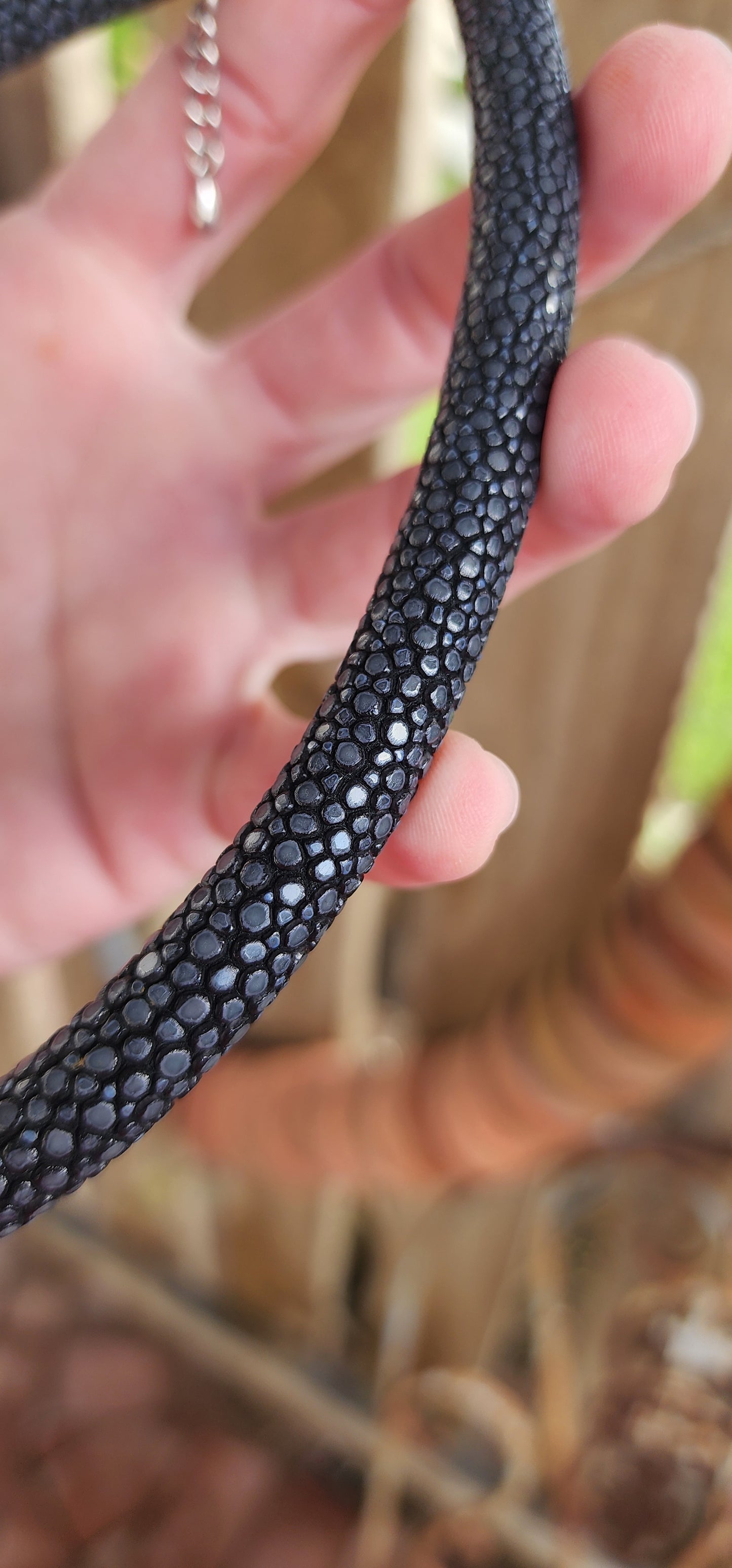 Such an unusual and exotic piece ! Chunky Black Stingray Leather tubed/pipe necklace with Sterling Silver ends and fitted with an Sterling Silver Lobster clasp and adjustable chain.