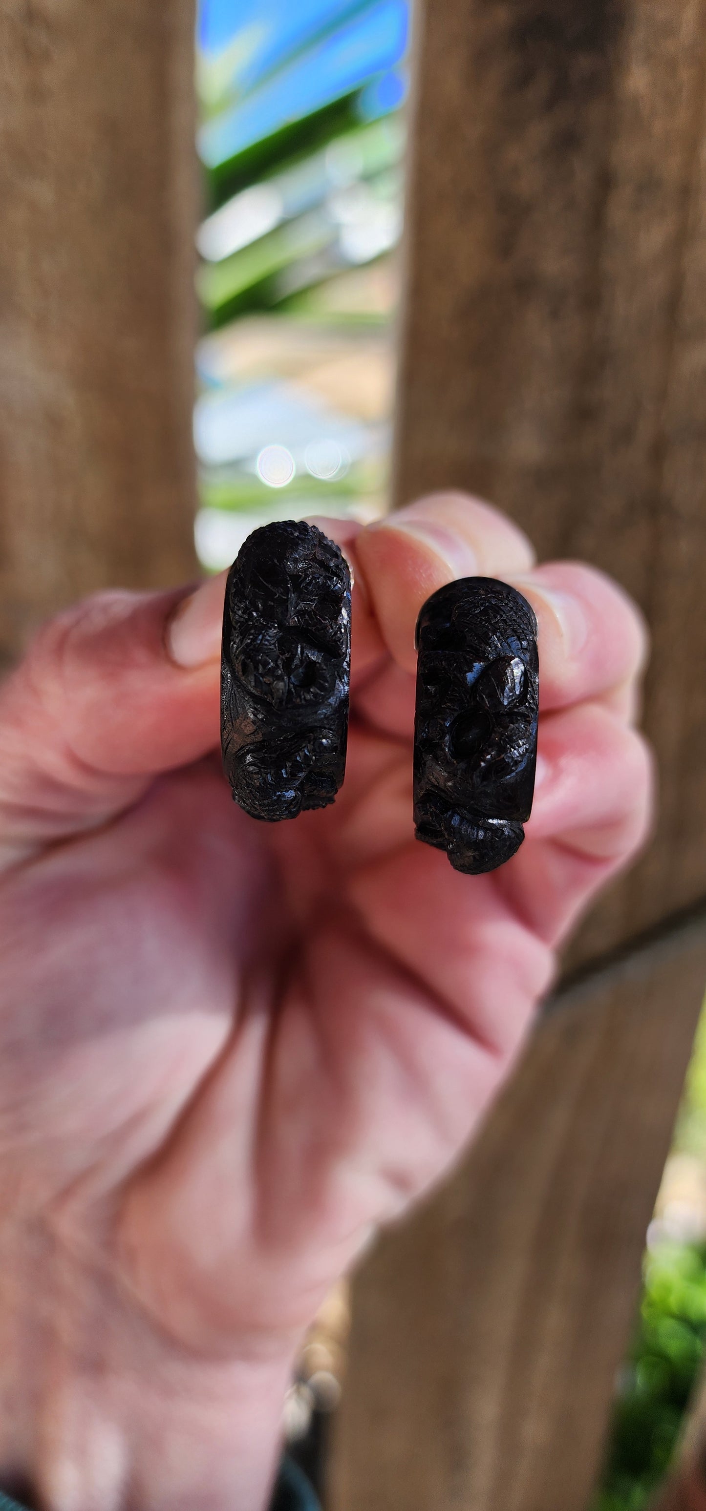 Vintage and chunky pair of Sterling Silver and Ebony wooden half hoop earrings.Each of the Black Ebony pieces ornately hand carved with majestic Elephant motifs.