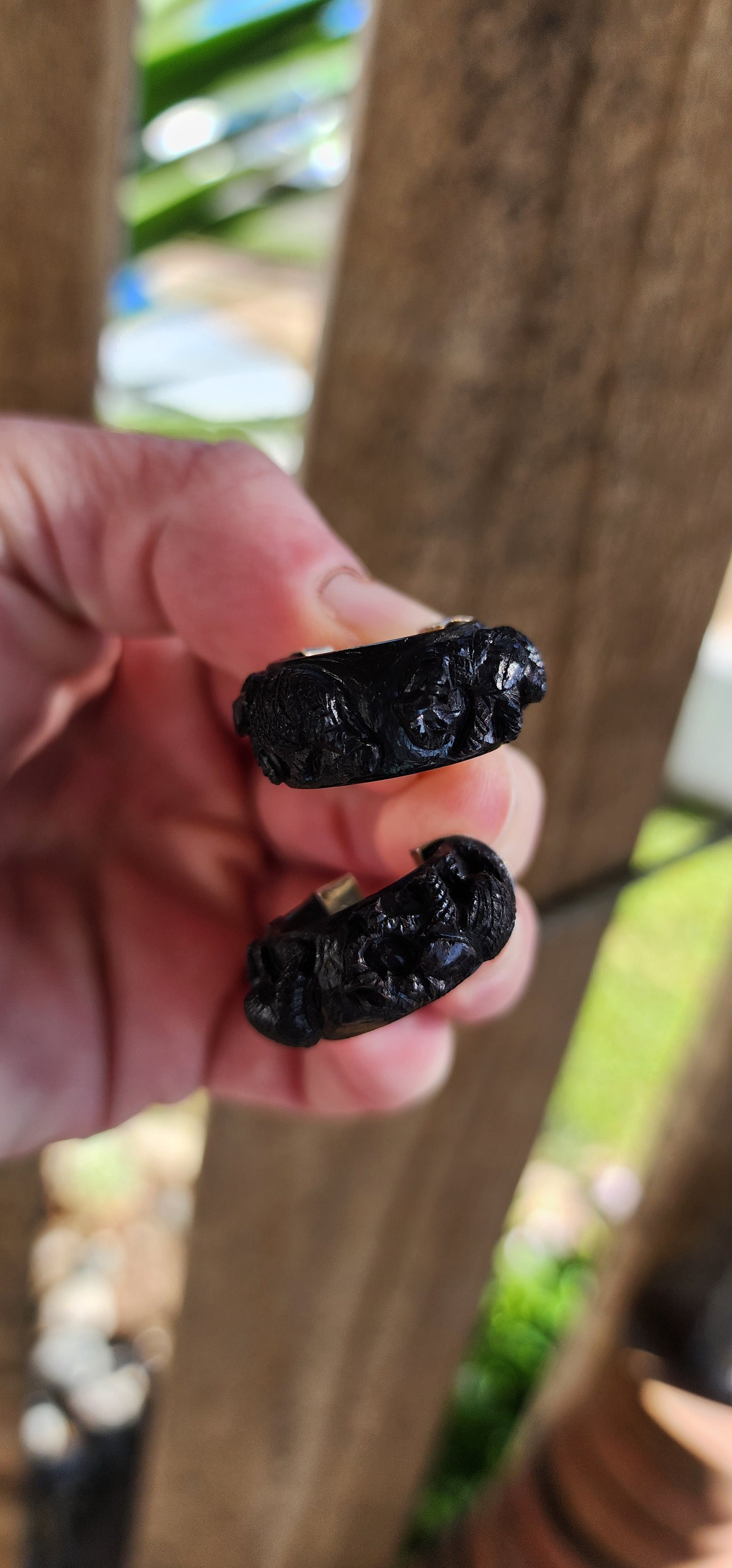 Vintage and chunky pair of Sterling Silver and Ebony wooden half hoop earrings.Each of the Black Ebony pieces ornately hand carved with majestic Elephant motifs.