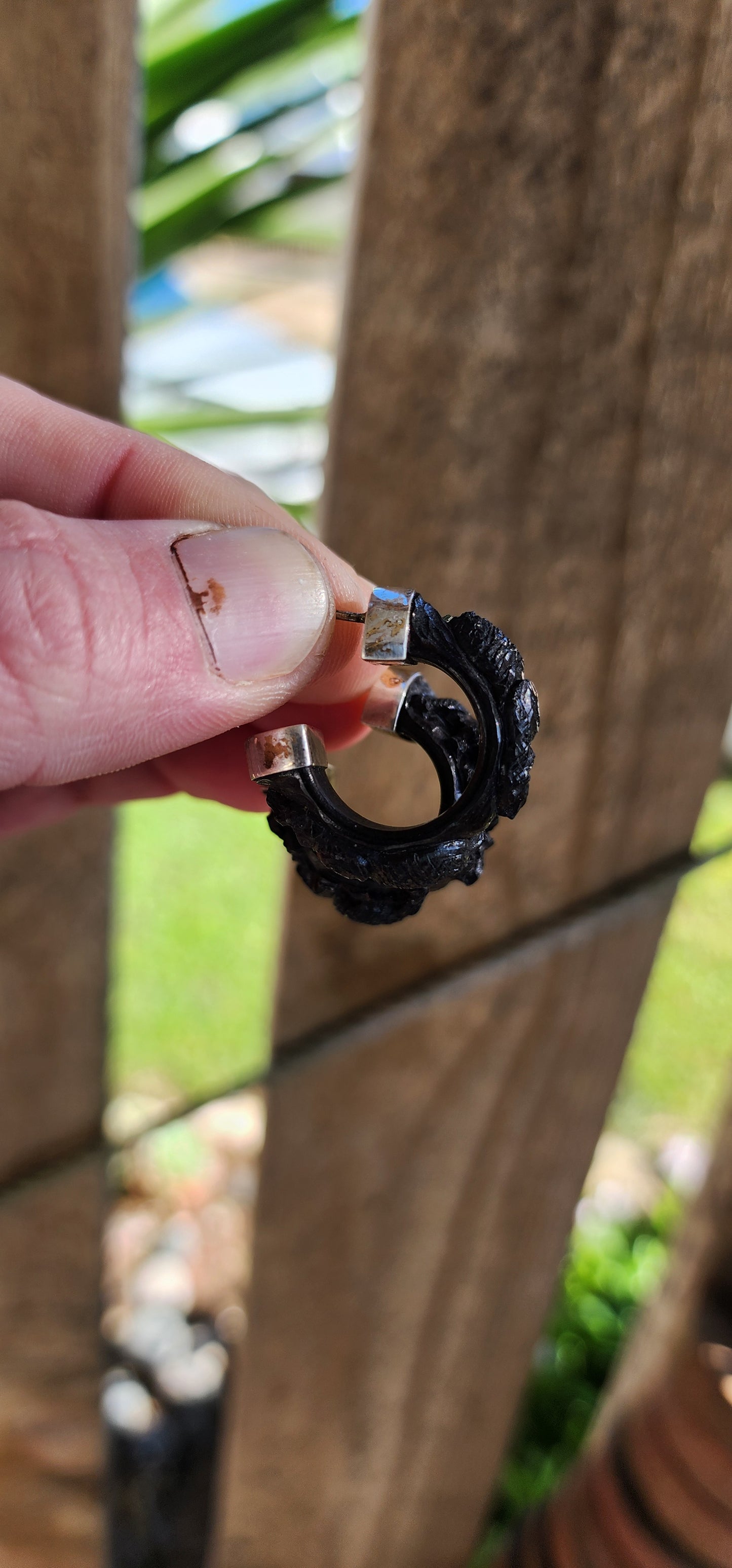 Vintage and chunky pair of Sterling Silver and Ebony wooden half hoop earrings.Each of the Black Ebony pieces ornately hand carved with majestic Elephant motifs.