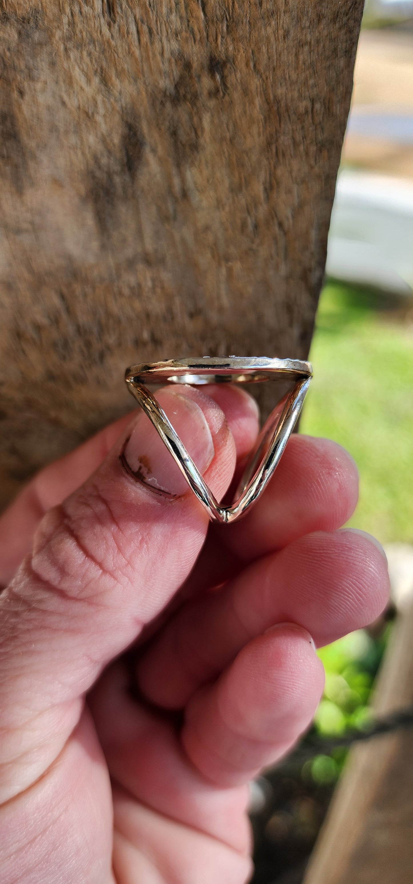 Unusual and chunky Artisan/Studio made Modernist in style Unisex Sterling Silver ring - An open/hammered Circle set on an double rounded tube split band.