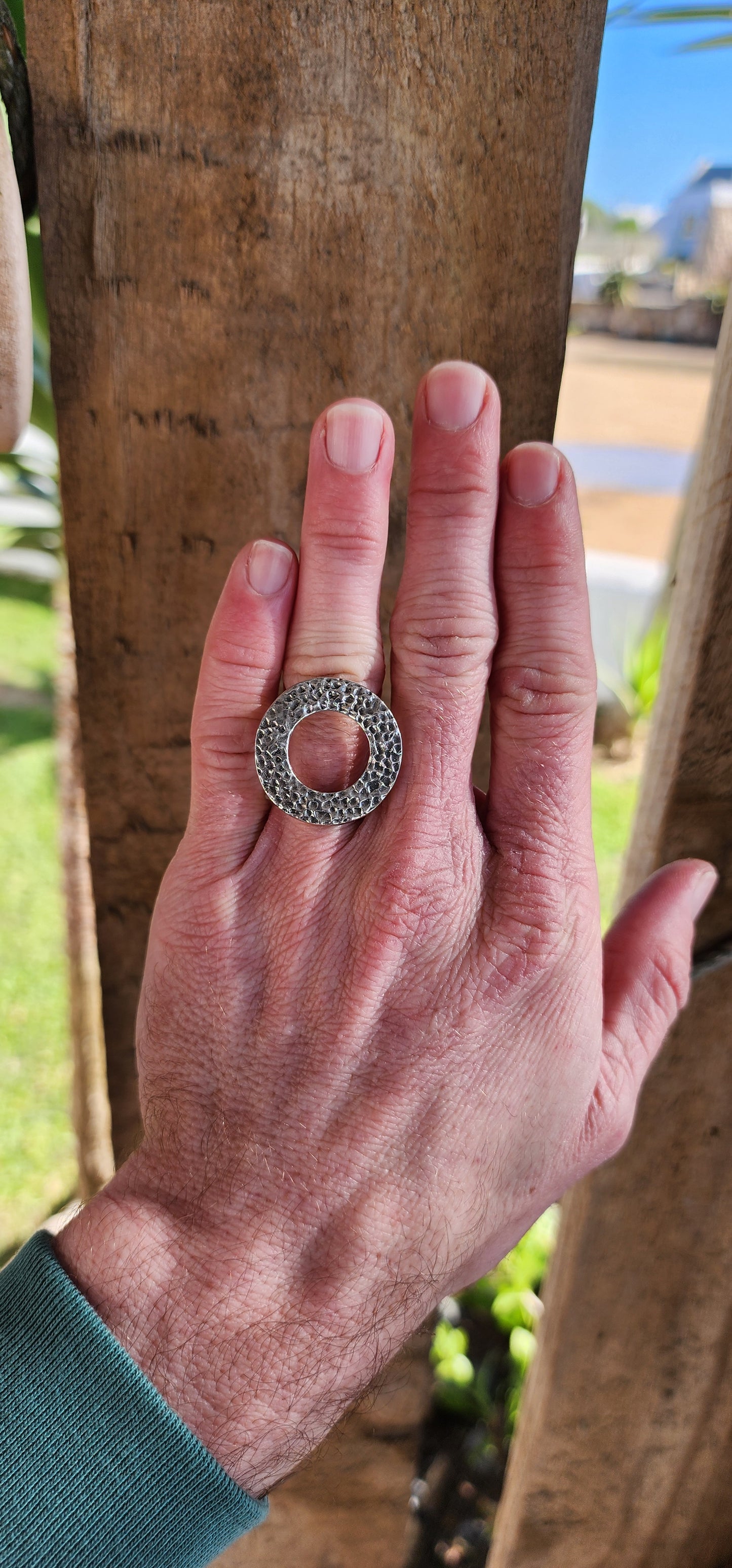 Unusual and chunky Artisan/Studio made Modernist in style Unisex Sterling Silver ring - An open/hammered Circle set on an double rounded tube split band.