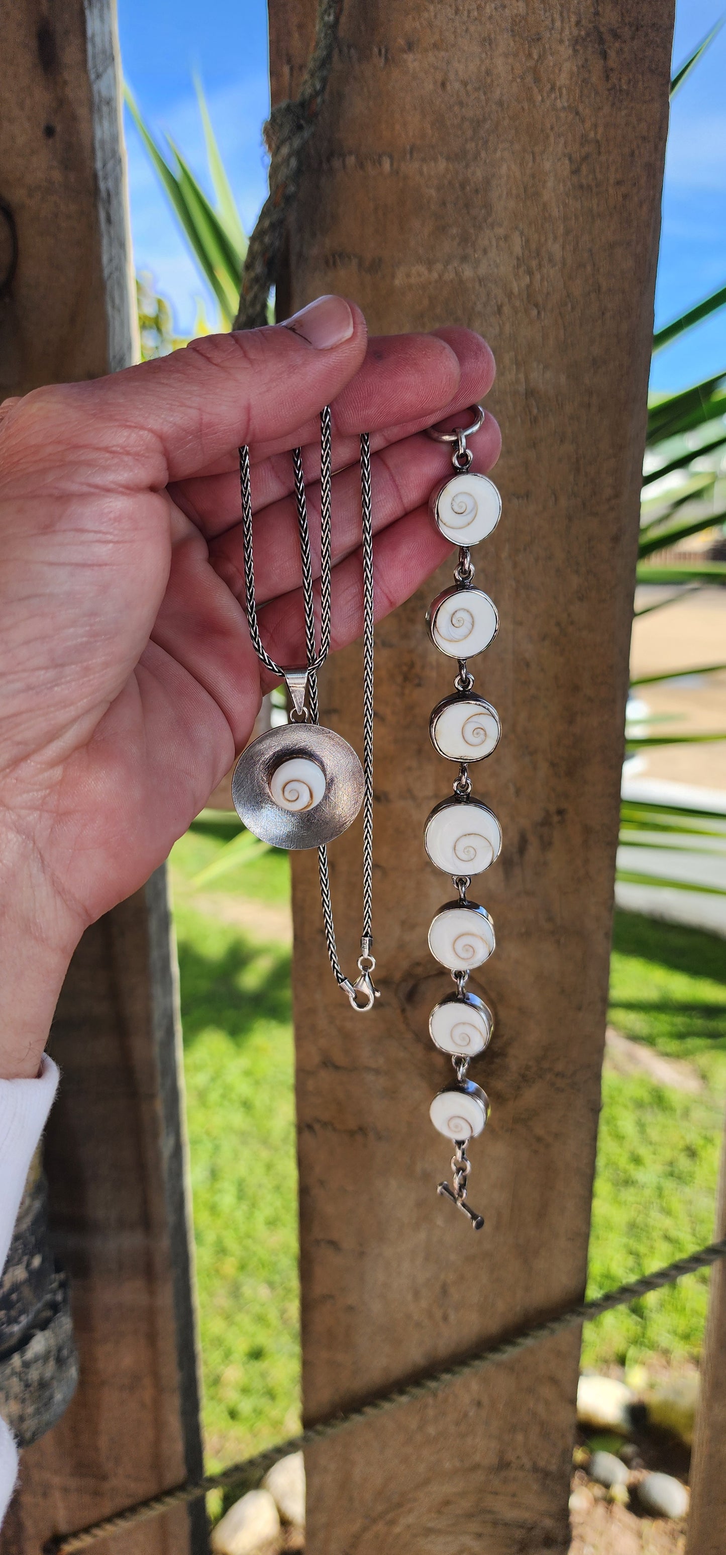 Sterling Silver and Operculum Spiral Shells "Shiva Eye" bracelet with matching Sterling Silver pendant on Sterling chain.