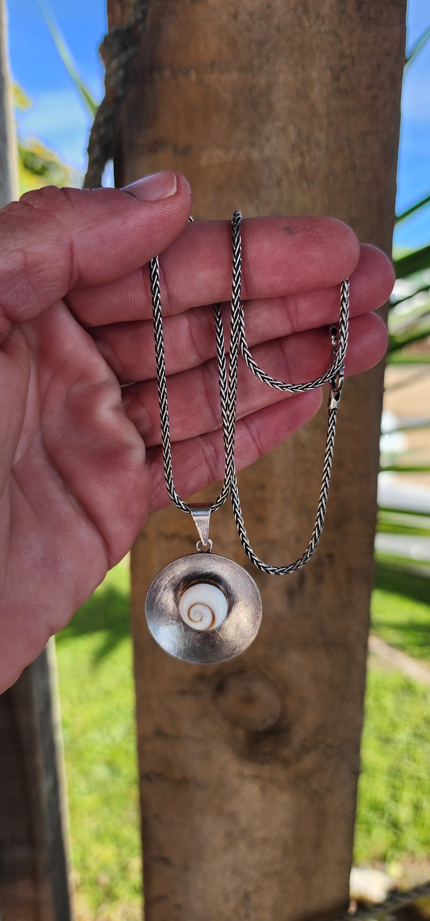 Sterling Silver and Operculum Spiral Shells "Shiva Eye" bracelet with matching Sterling Silver pendant on Sterling chain.