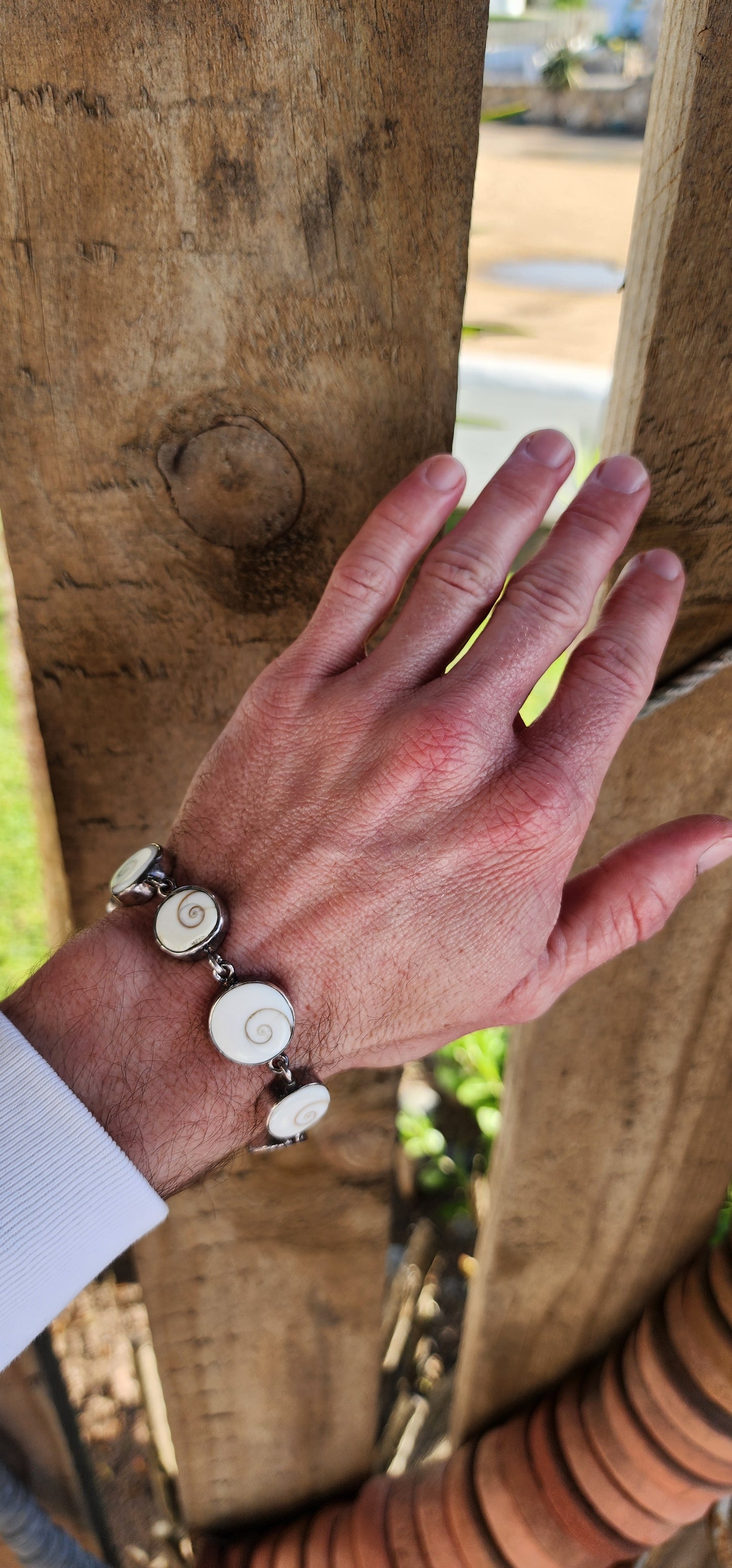 Sterling Silver and Operculum Spiral Shells "Shiva Eye" bracelet with matching Sterling Silver pendant on Sterling chain.