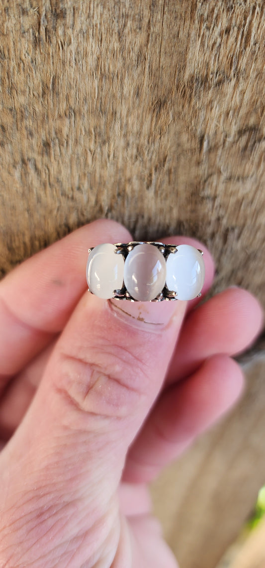 Sterling Silver and Oval Cat's Eye Moonstone Cabochon Gemstones Trilogy ring .The little pierced Hearts on the sides of this ring add that extra special touch.