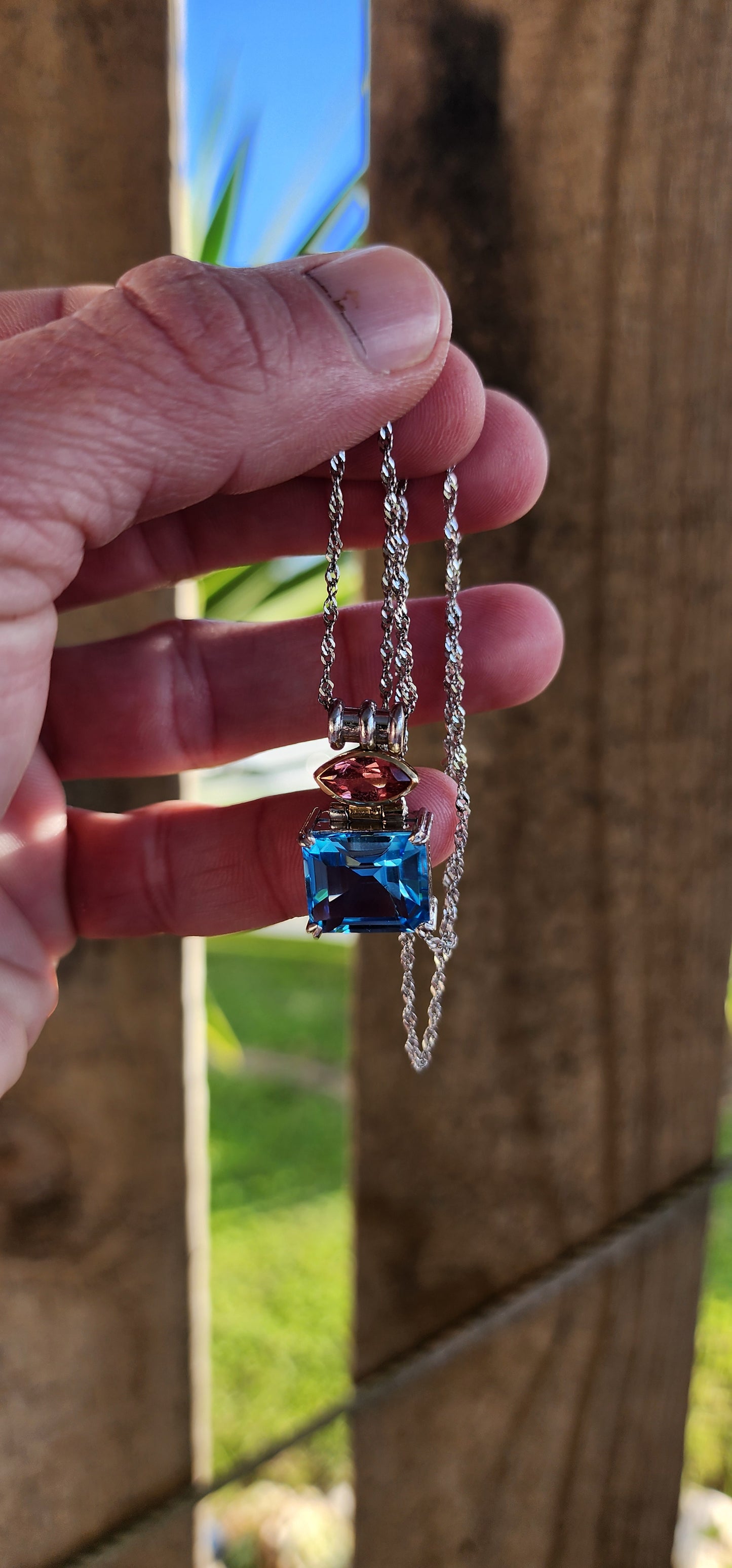 Exquisite 18ct White and Yellow Gold pendant with Blue Topaz and Pink Tourmaline Gemstones -Comes on a 14ct White Gold chain.