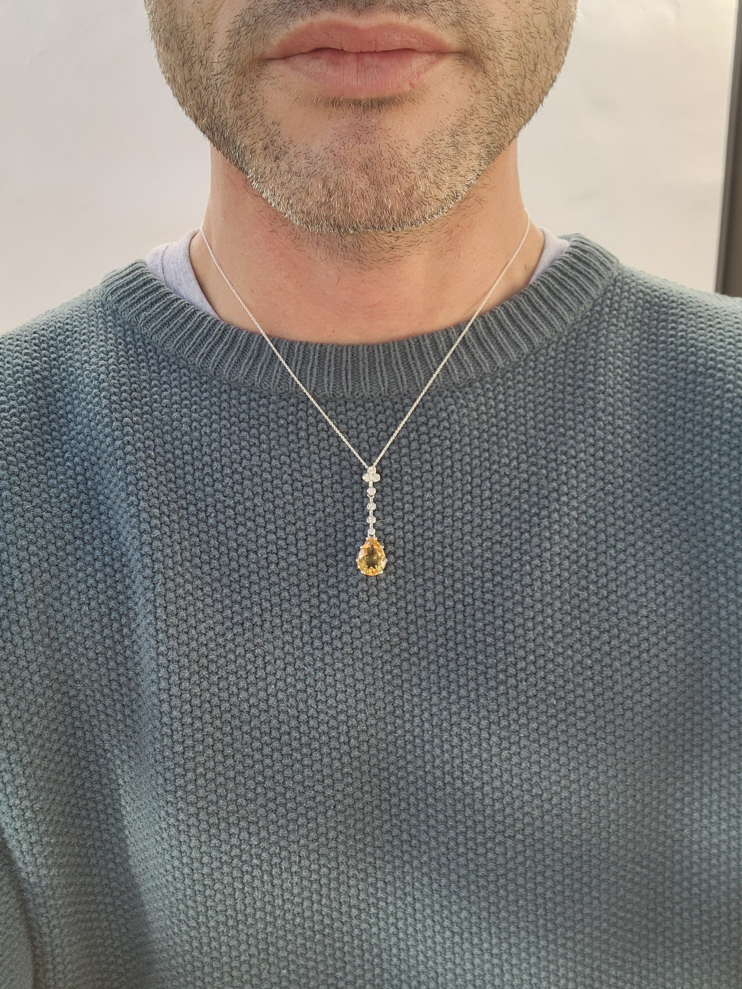 Absolutely stunning Art Deco inspired Sterling Silver pendant prong set with a Yellow Pear cut Citrine dangle suspended from a line drop of sparkly Round tube/bezel set CZ Gemstones,fitted on a adjustable Sterling Silver chain.