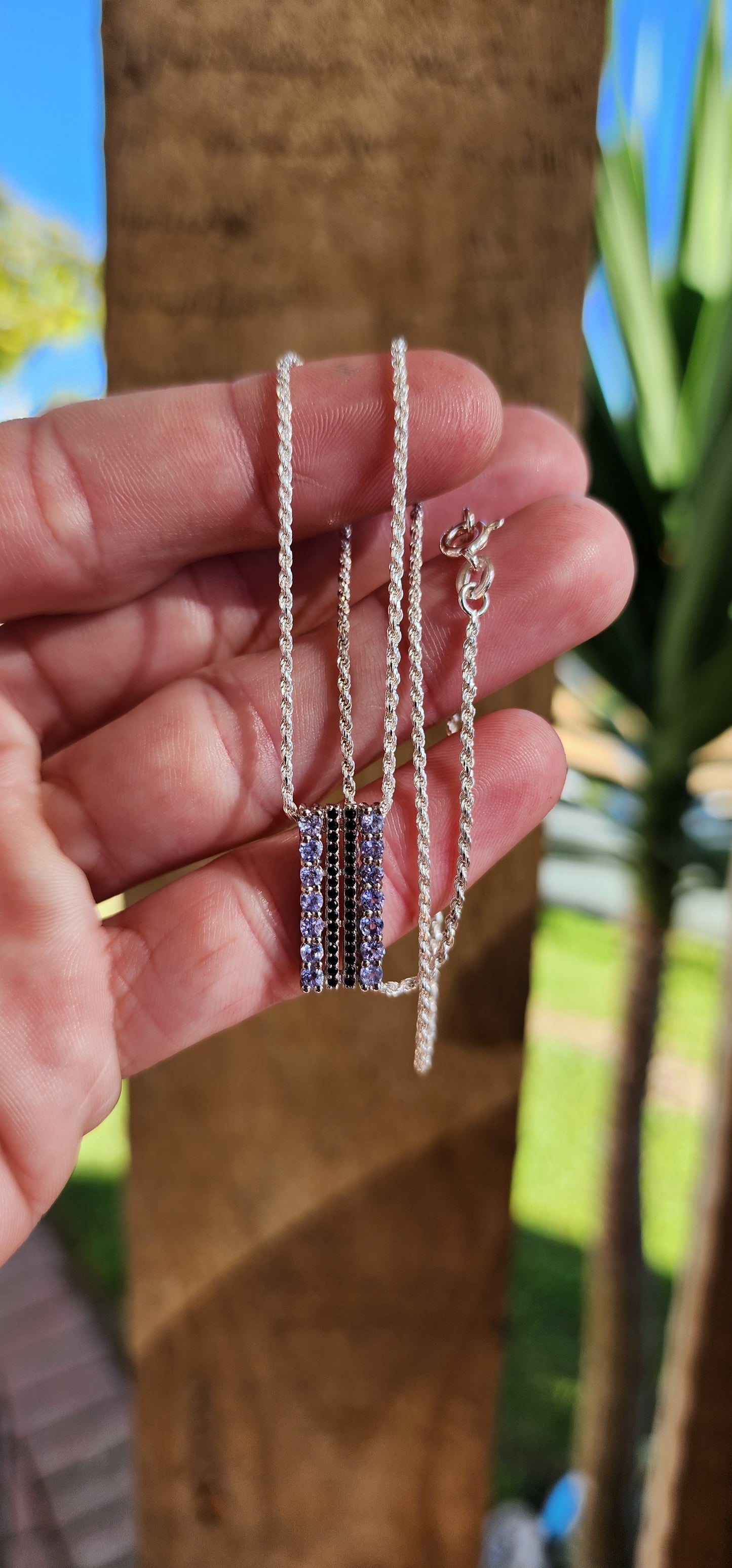 Marvelous Sterling Silver, Natural Tanzanite and Black Spinel Gemstones matching set consisting out of ring , push-in hoop earrings with safety clips and pendant on rope chain.