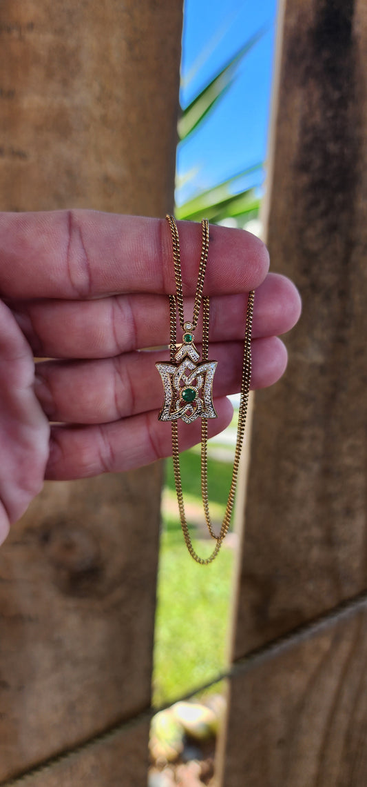 Elegant Art Deco style beauty - Sterling Silver with 18ct Yellow Gold plating,Natural Emeralds and clear CZ Gemstones pendant with a Art Deco appeal.