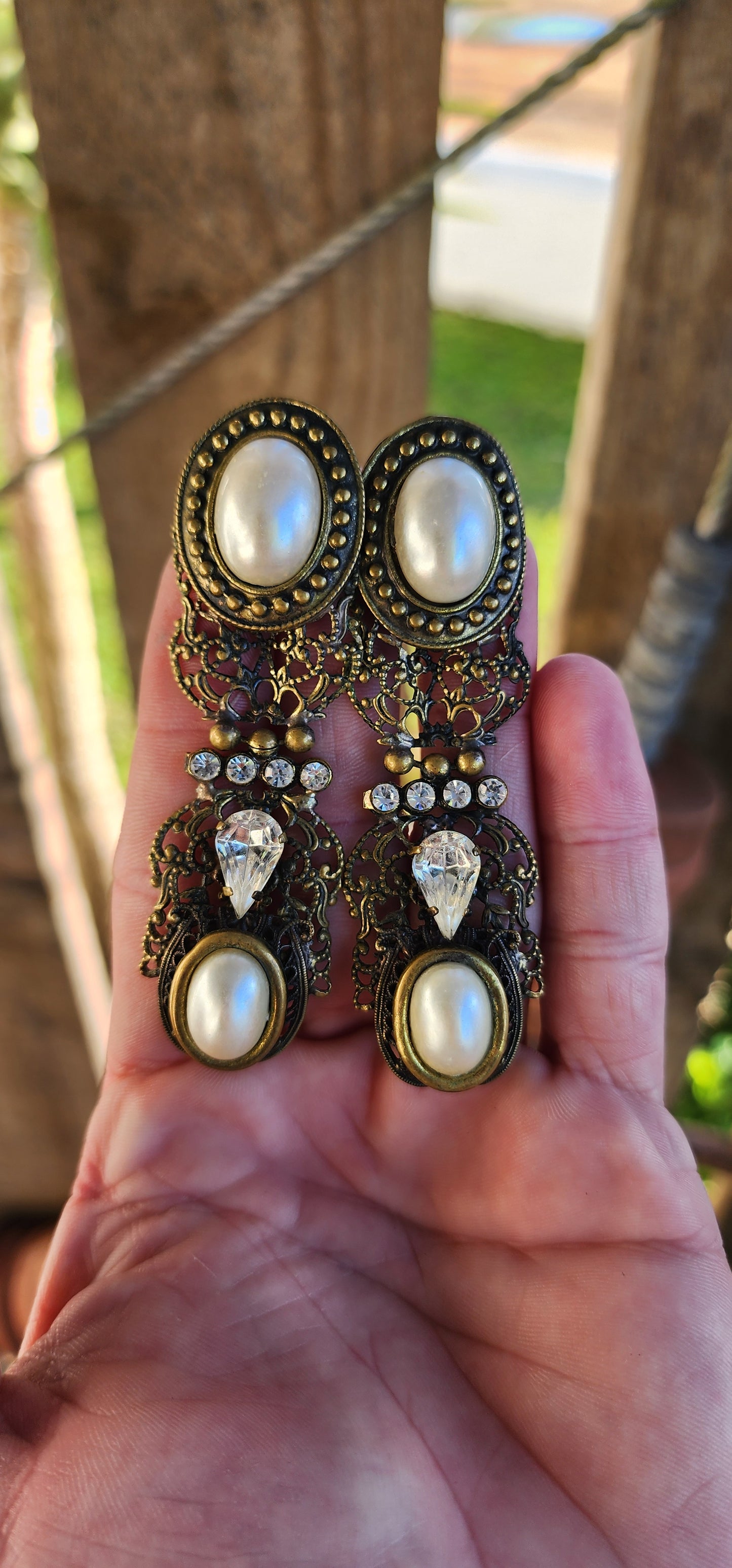 Oversized pair of Vintage costume long pendant/drop statement earrings.Antiqued Bronze Filigree with Faux Pearls and Clear Rhinestones.