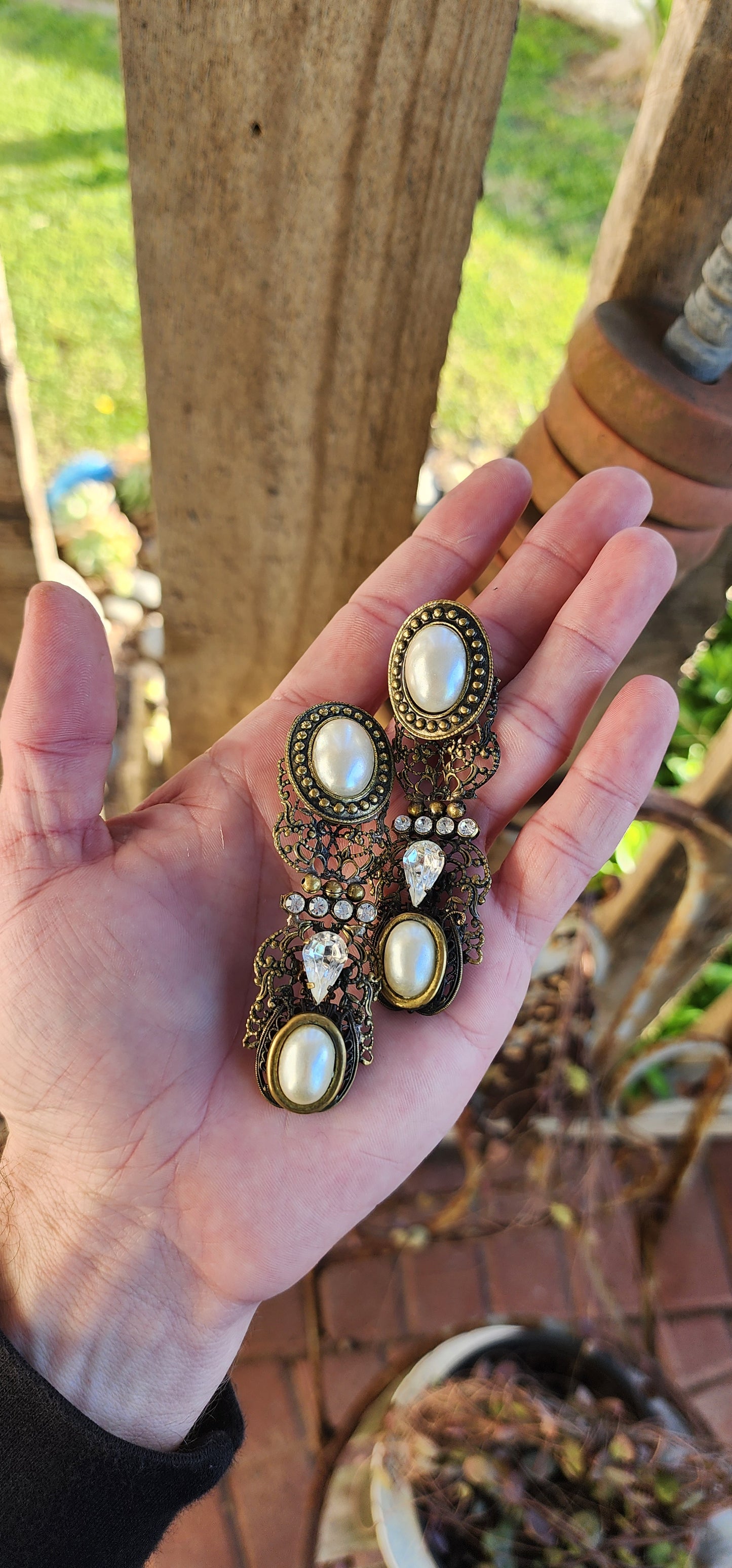 Oversized pair of Vintage costume long pendant/drop statement earrings.Antiqued Bronze Filigree with Faux Pearls and Clear Rhinestones.