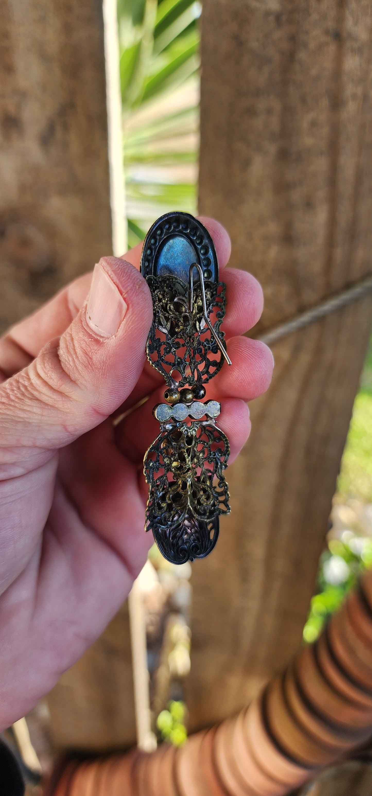 Oversized pair of Vintage costume long pendant/drop statement earrings.Antiqued Bronze Filigree with Faux Pearls and Clear Rhinestones.