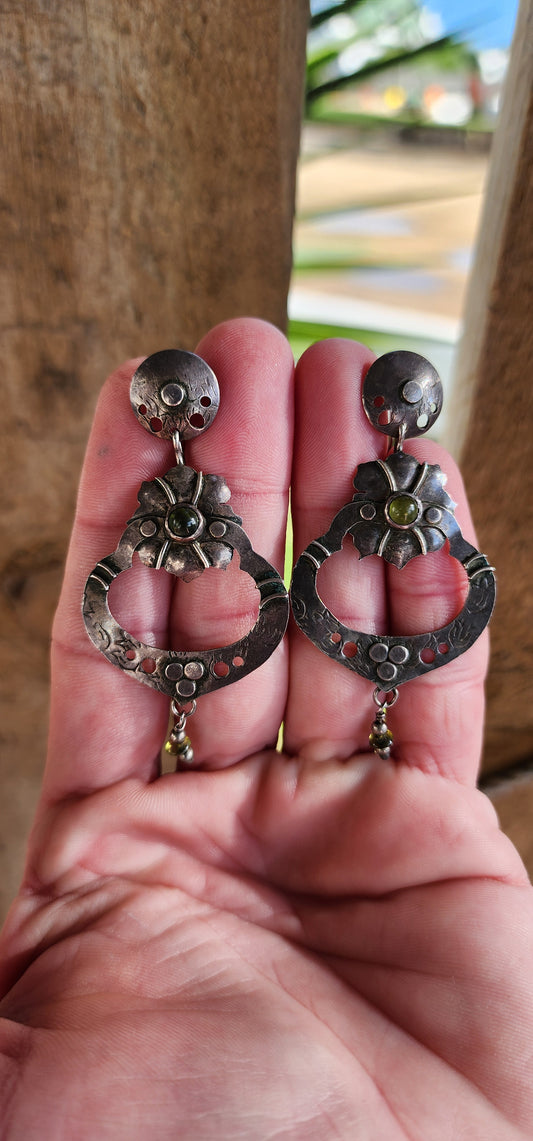 Marvelous and large pair of Sterling Silver and Peridot Cabochons Arts and Crafts/Art Nouveau era drop/dangle earrings with a traditional Mexican design.(I cant help but think of Frida Kahlo when I look a these)