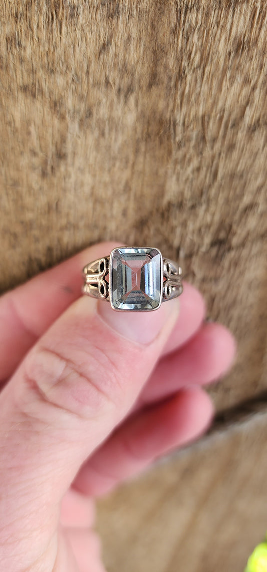 Beautiful Vintage Sterling Silver Solitaire style double band ring - Bezel/Tube set with a Emerald cut Blue Topaz Gemstone in a raised setting.The Shoulders ornately decorated.