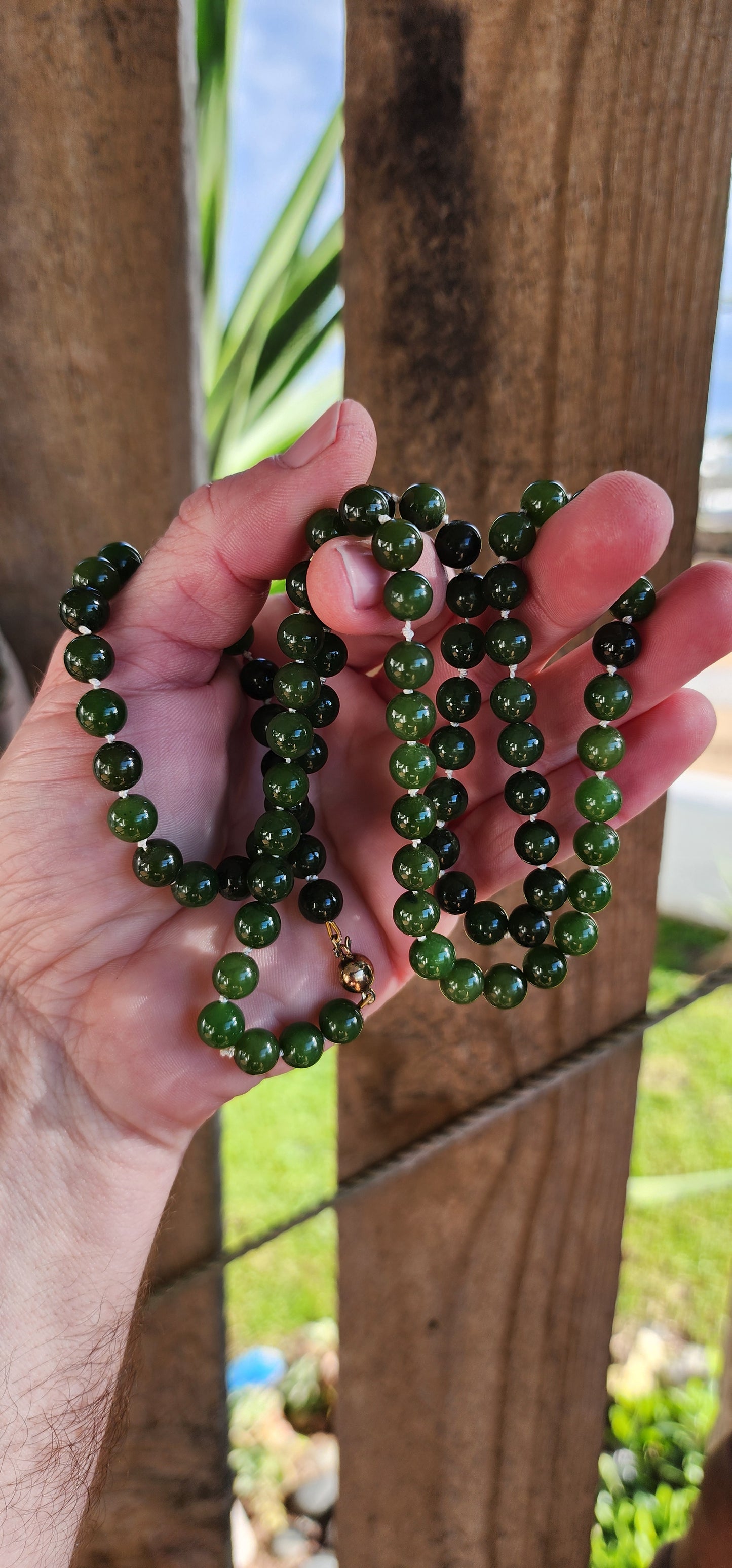 Marvelous Vintage extra length dark Green Nephrite "spinach" Jade beaded necklace, fitted with a 9ct Yellow Gold circular clasp.
These stunning beads are perfectly Round in shape and flaunt lovely shades of Green.