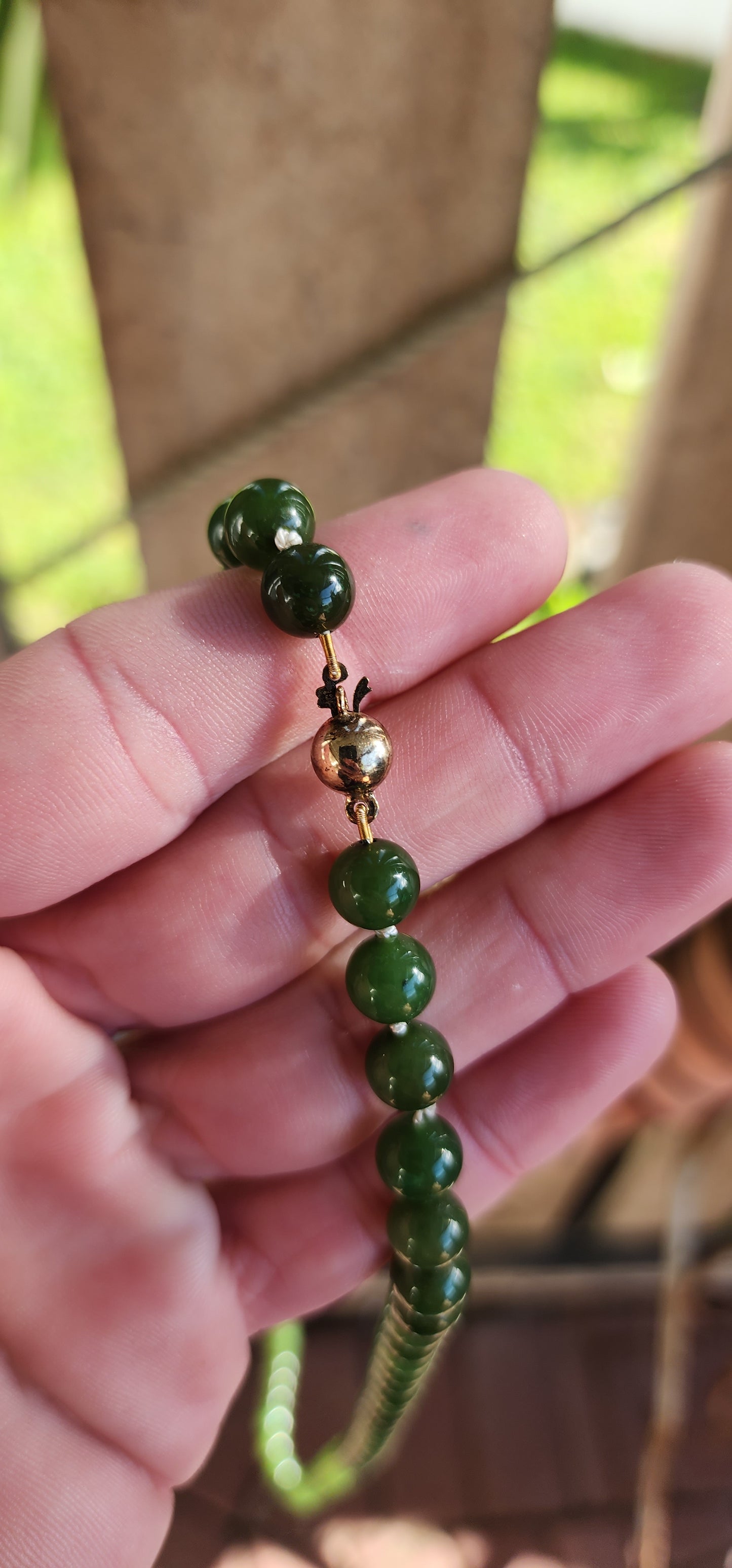 Marvelous Vintage extra length dark Green Nephrite "spinach" Jade beaded necklace, fitted with a 9ct Yellow Gold circular clasp.
These stunning beads are perfectly Round in shape and flaunt lovely shades of Green.