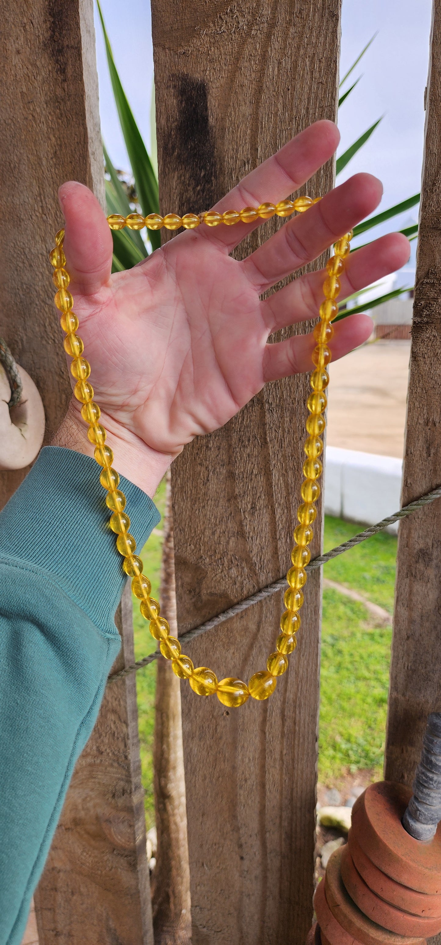 Vintage Art Deco circa 1930's Czech Yellow Uranium Vaseline Glass beaded necklace.
This stunning necklace is made from a string of graduating Yellow Uranium glass beads in Oval shapes.