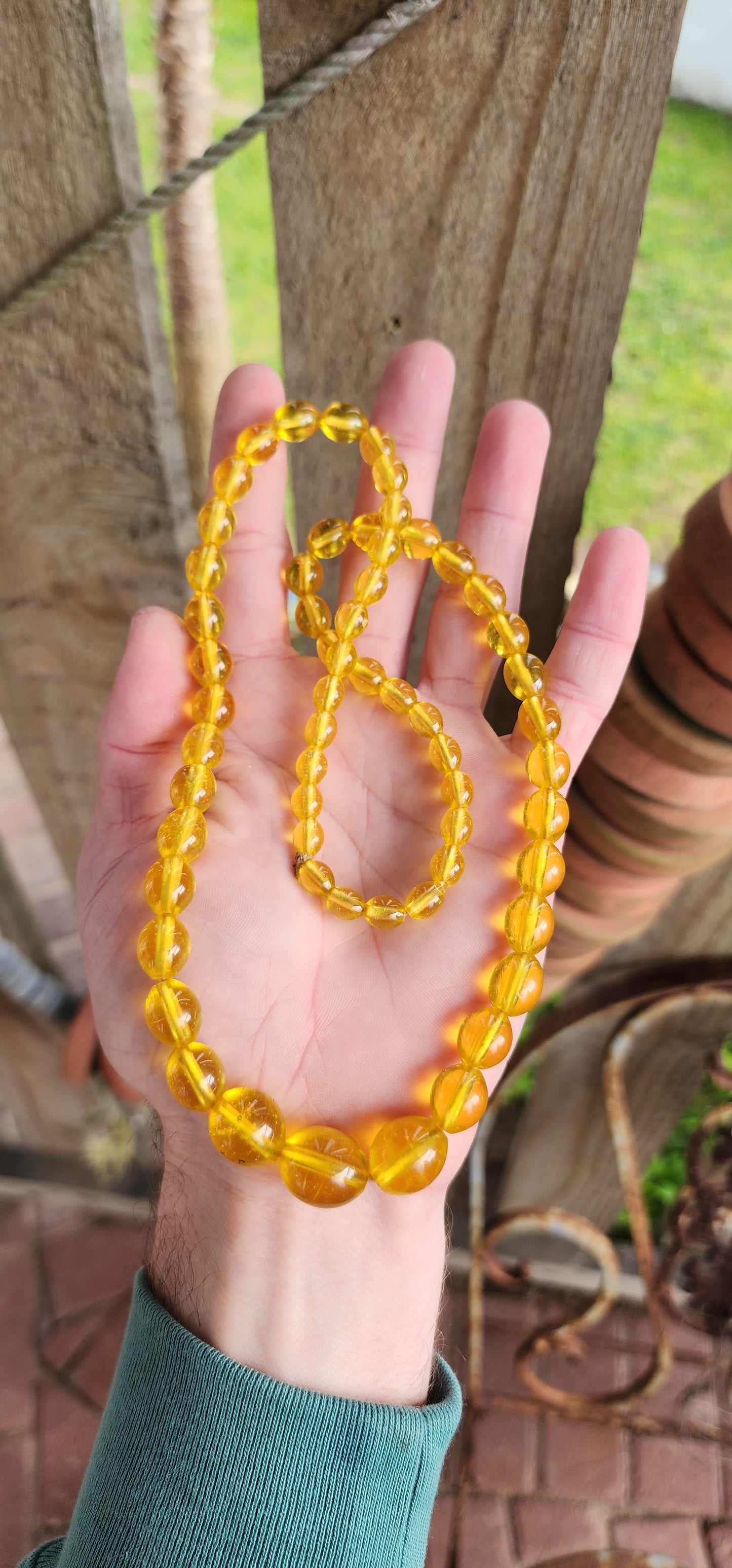 Vintage Art Deco circa 1930's Czech Yellow Uranium Vaseline Glass beaded necklace.
This stunning necklace is made from a string of graduating Yellow Uranium glass beads in Oval shapes.