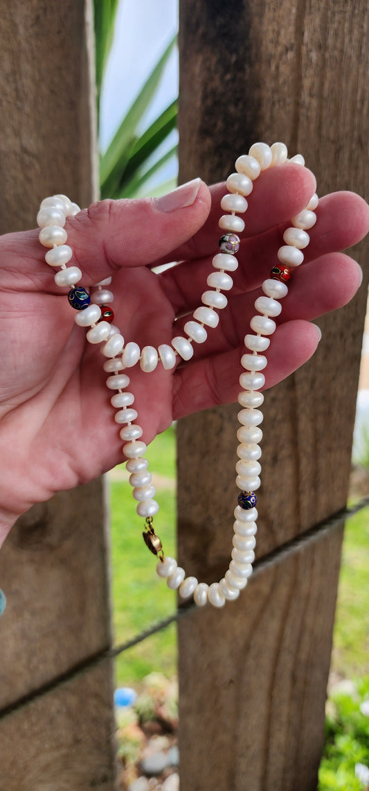 Vintage and Classical necklace featuring Freshwater Button Pearls with added Cloisonne spacer beads .