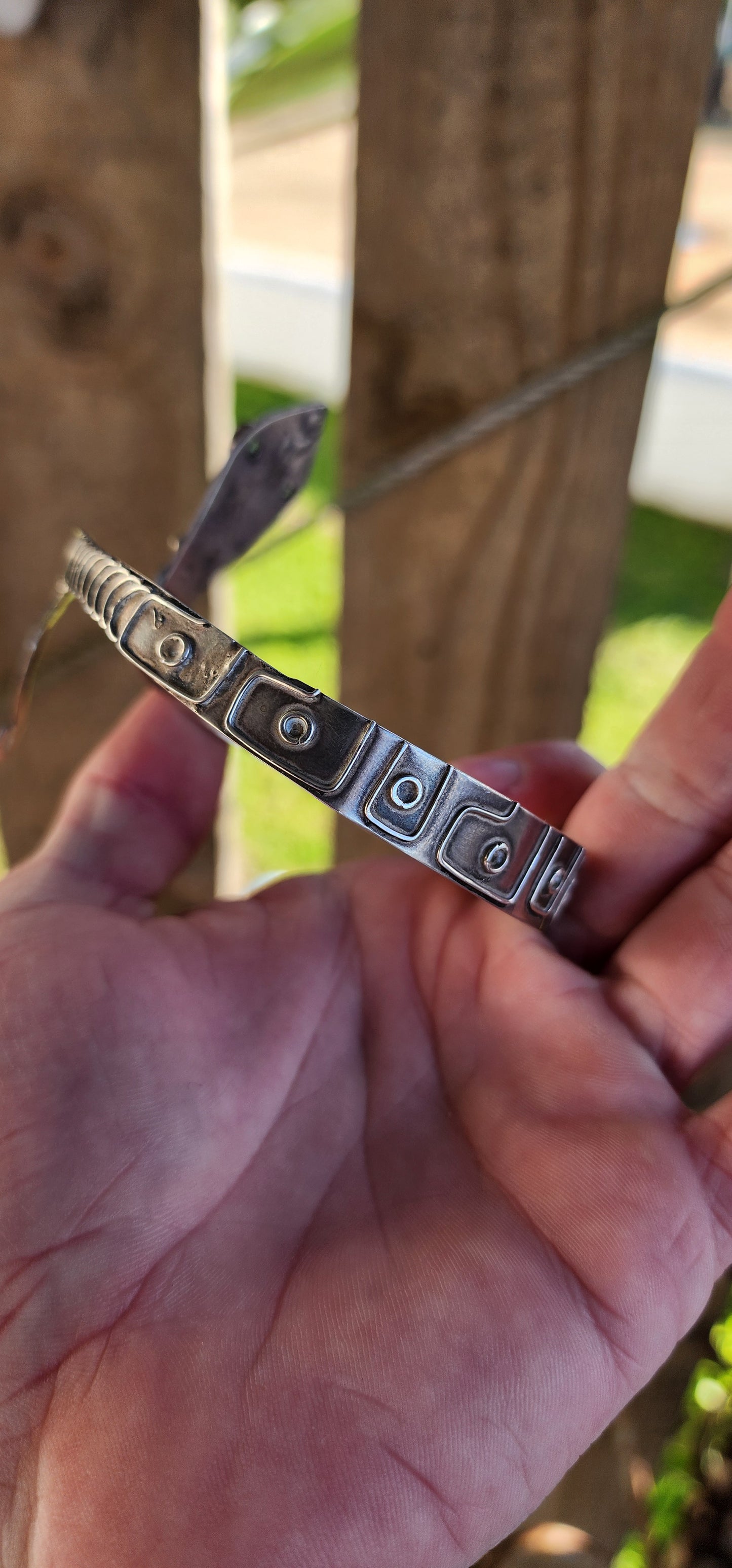 Vintage Egyptian Revival Arts and Crafts movement upper arm Serpent bracelet - Crafted in Sterling Silver with a embossed patterned body/tail, the Serpents eyes have been set with Natural Oval cut Emeralds in bezel/tube settings.