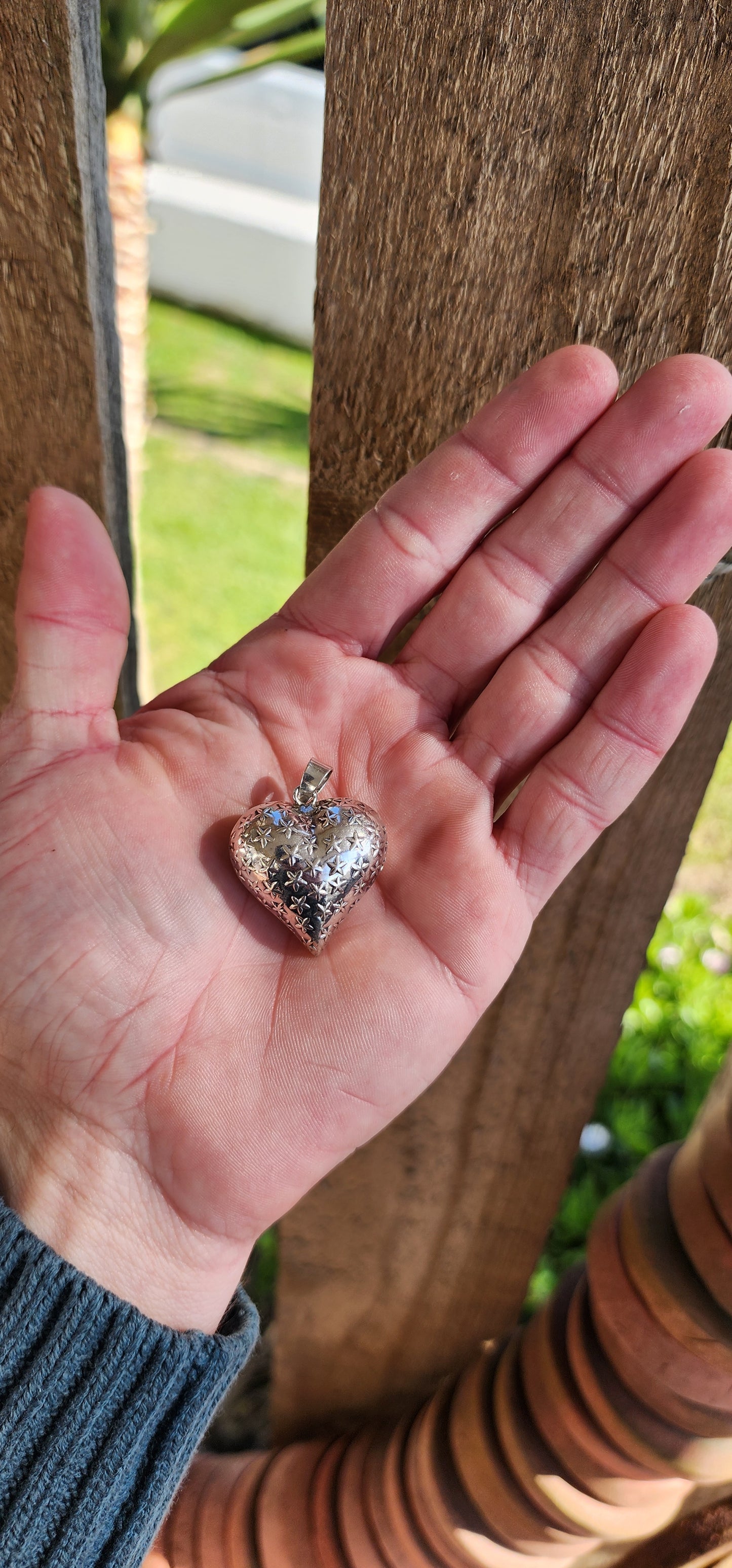 Chunky Vintage Sterling Silver, two-sided, repousse puffy Heart pendant featuring clusters of embossed Stars on both sides.