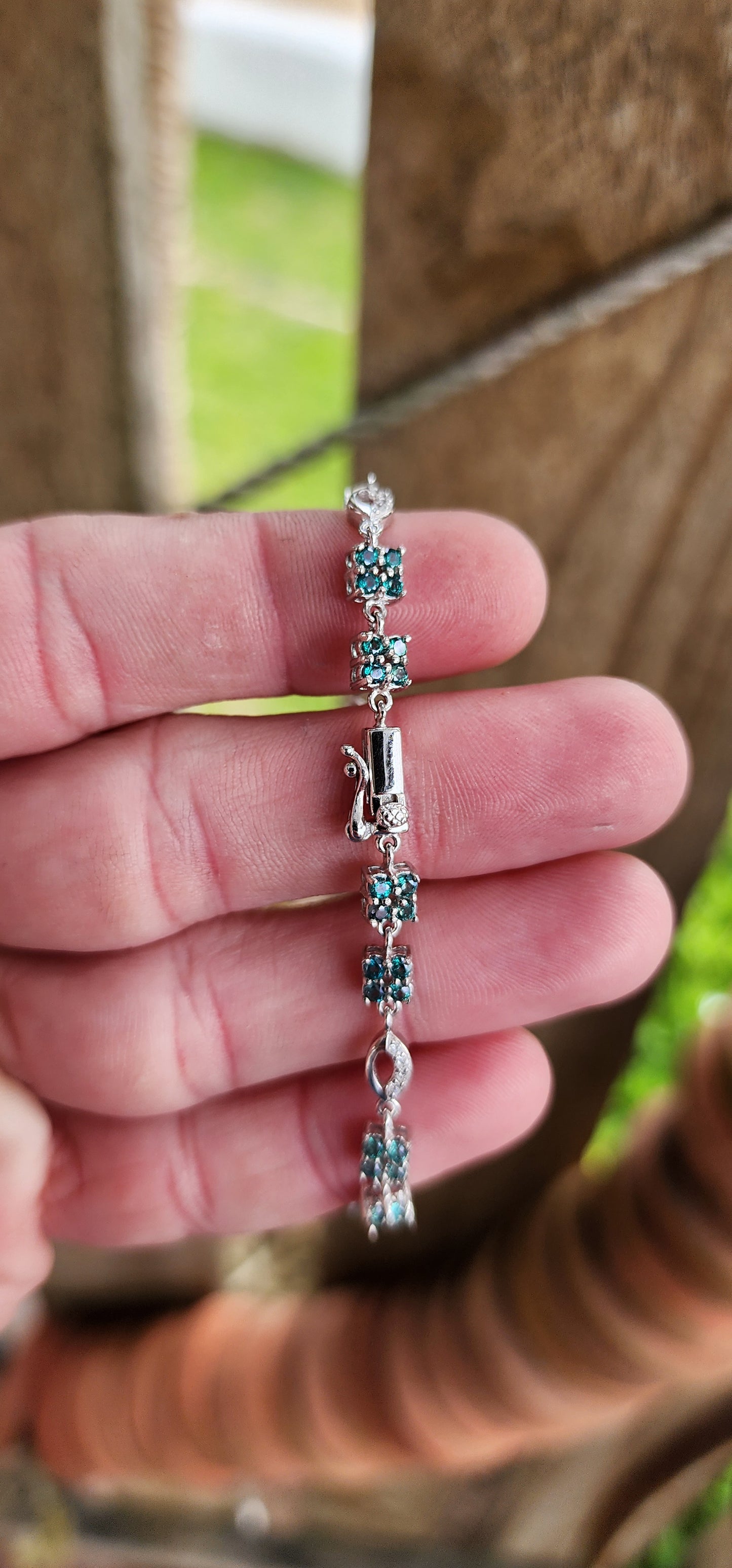 Elegant Sterling Silver , Green Topaz and CZ Gemstones Tennis bracelet - Fitted with a push-in box clasp and safety latch.