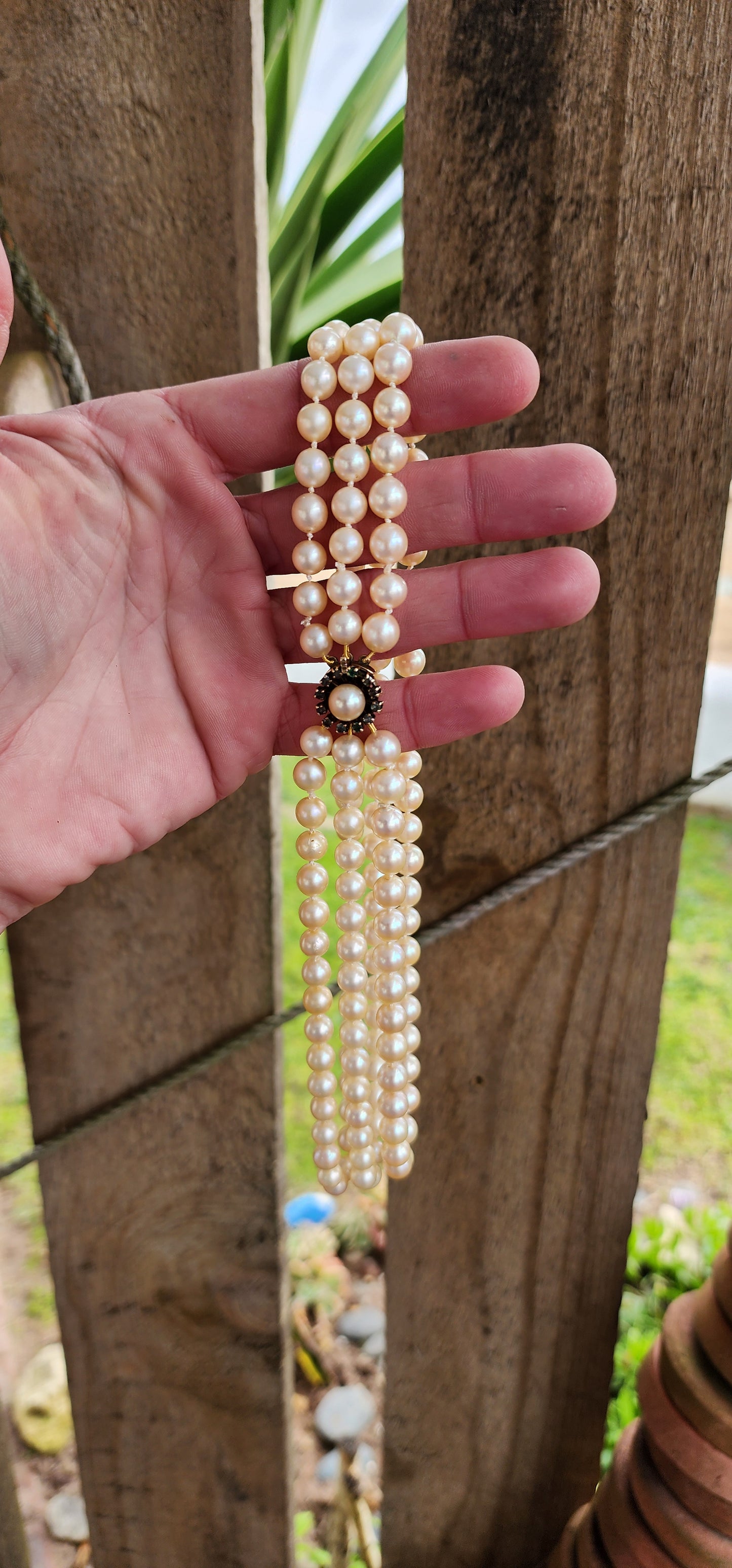 Sensational Vintage 1940's 3 strand Marine Cultured Pearl necklace fitted with a 9ct Yellow Gold,Round cut Emeralds and Pearl clasp.