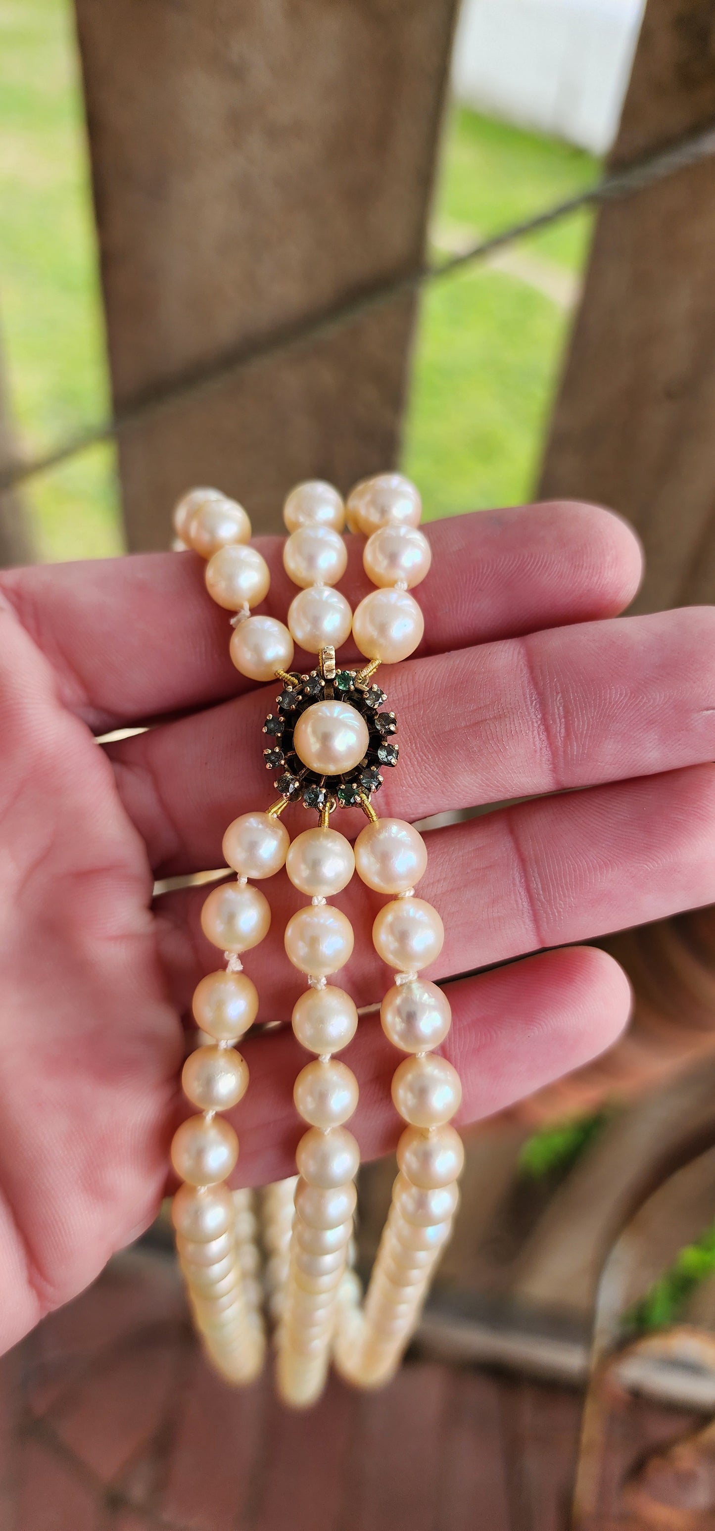 Sensational Vintage 1940's 3 strand Marine Cultured Pearl necklace fitted with a 9ct Yellow Gold,Round cut Emeralds and Pearl clasp.