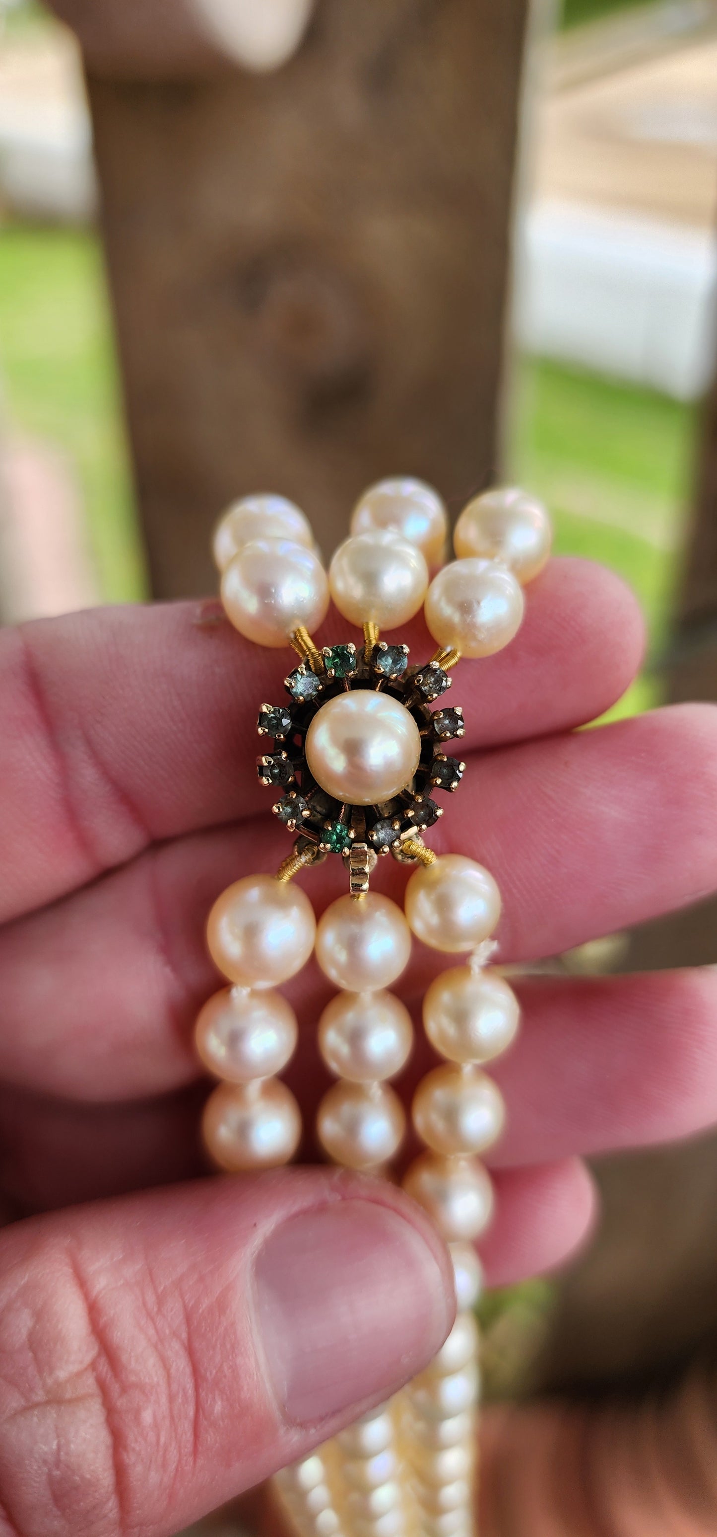 Sensational Vintage 1940's 3 strand Marine Cultured Pearl necklace fitted with a 9ct Yellow Gold,Round cut Emeralds and Pearl clasp.