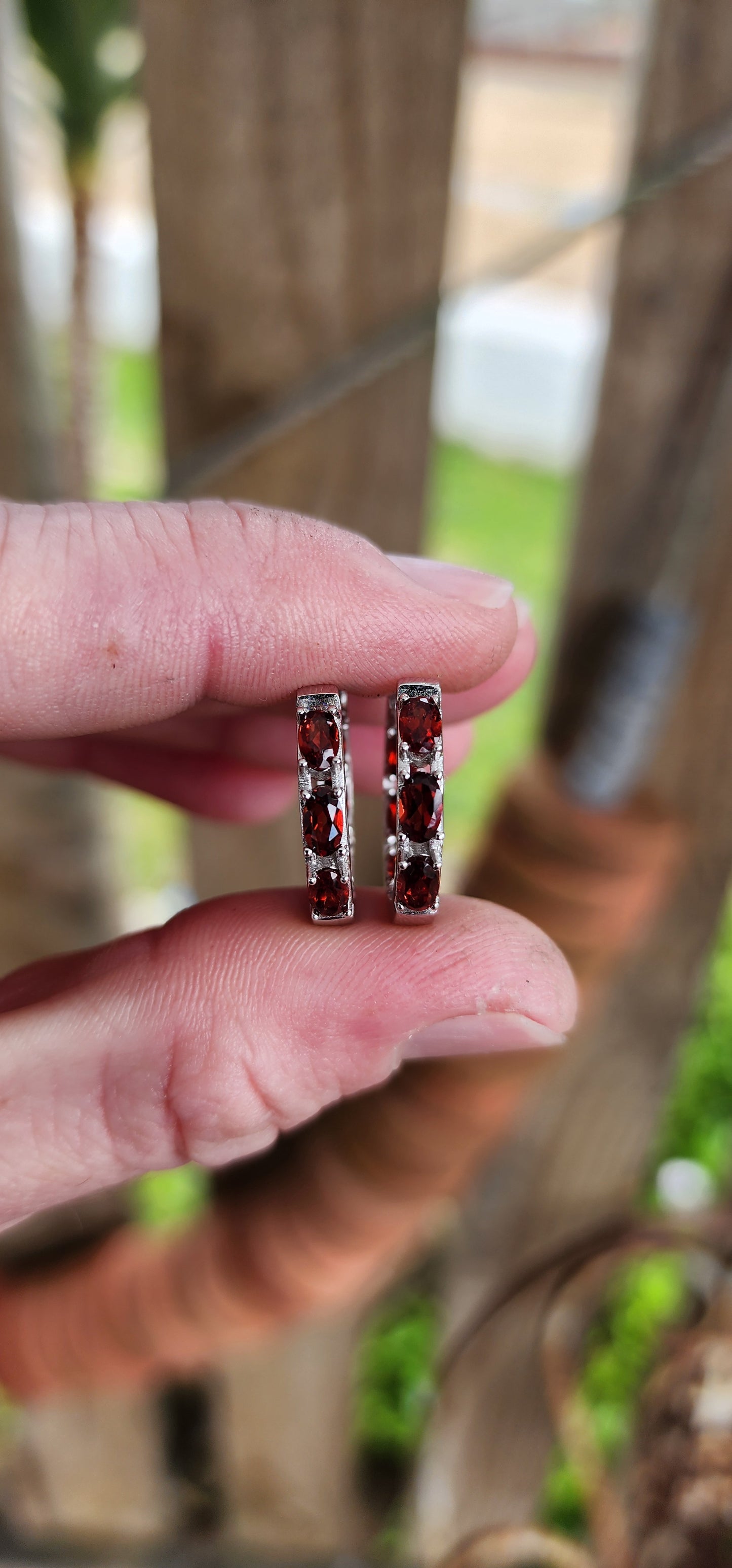 Gorgeous pair of Sterling Silver and Almandine Garnet Gemstones Huggies/Hoop earrings .Each earring set with 6x Oval Faceted Cut Garnets.