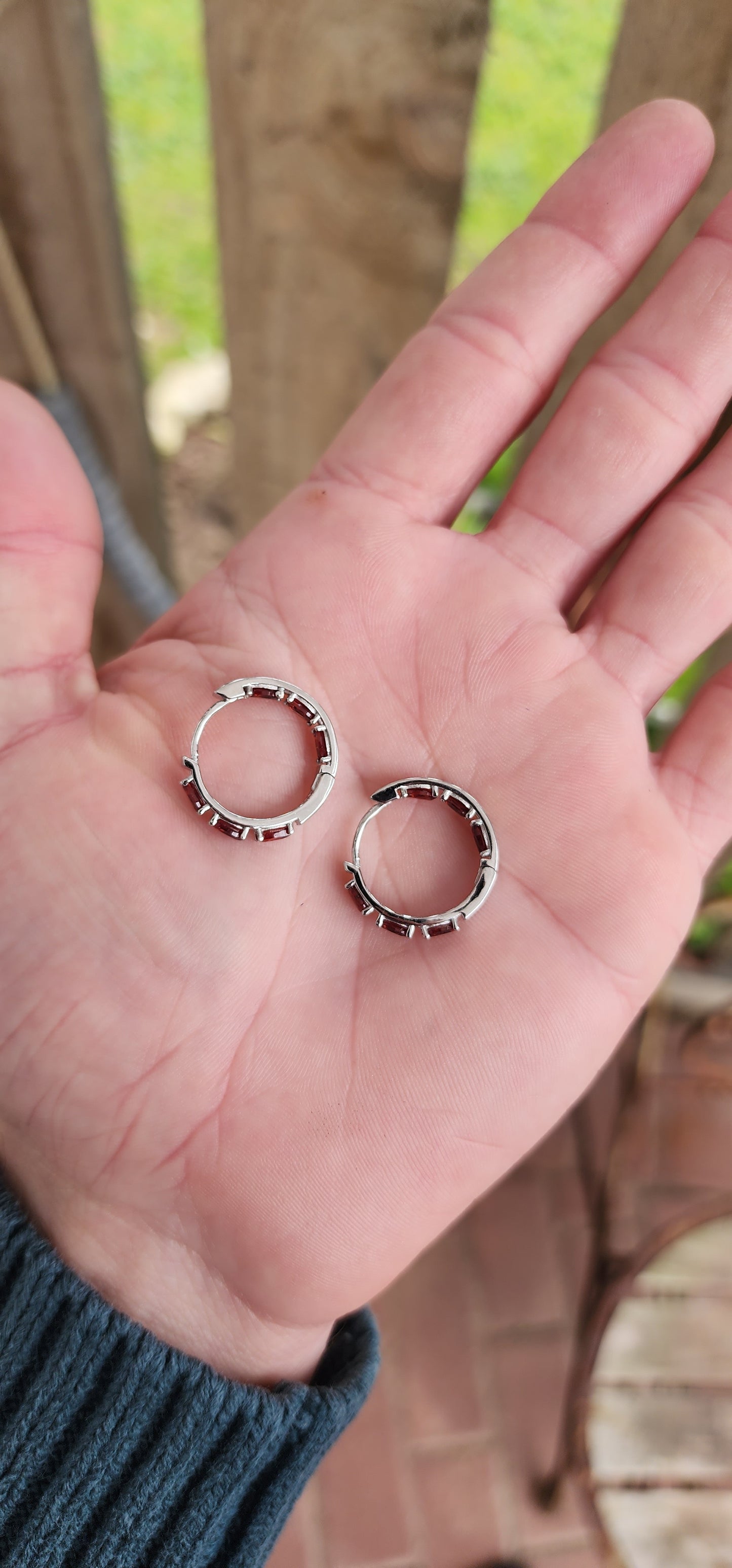 Gorgeous pair of Sterling Silver and Almandine Garnet Gemstones Huggies/Hoop earrings .Each earring set with 6x Oval Faceted Cut Garnets.