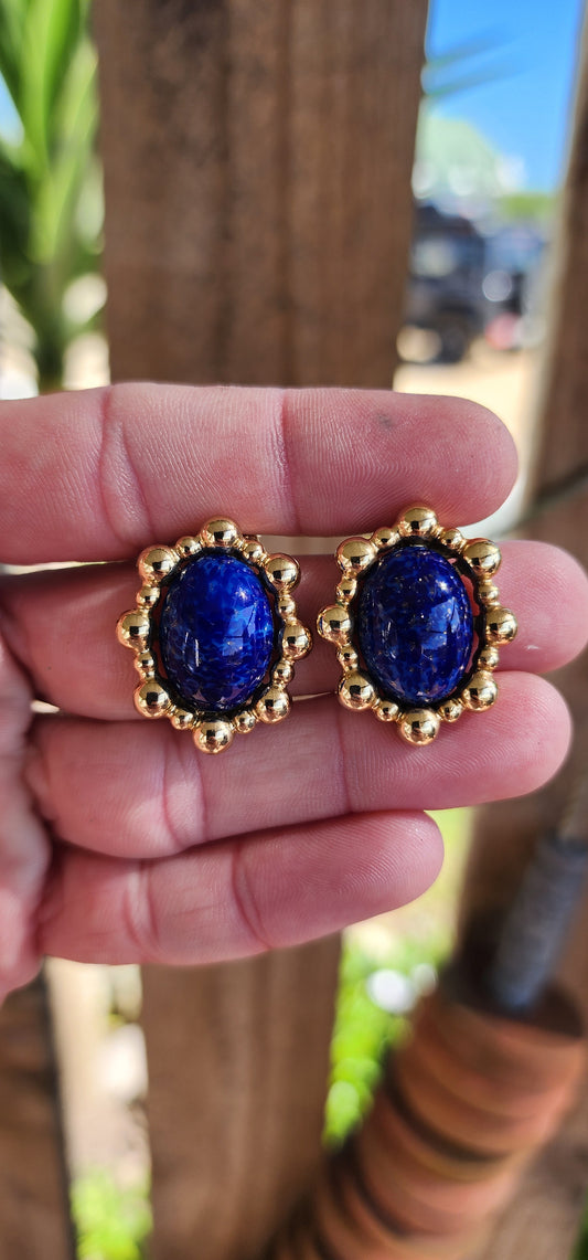 Beautiful Vintage pair of Designer costume oval clip-on earrings designed by very well known and sought after Designer "Grosse" and signed accordingly. The earrings are Gold plated and adorned with Venetian Glass imitations of cabochon cut Lapis Lazuli.