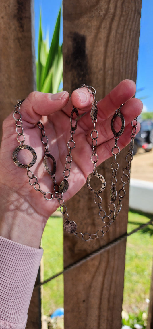 Amazing Vintage extra length Studio made Modernist/Brutalist Sterling Silver claspless necklace.The necklace comprising out of textured/hammered and patinated open Circle and disck links jointed by textured/hammered chains.