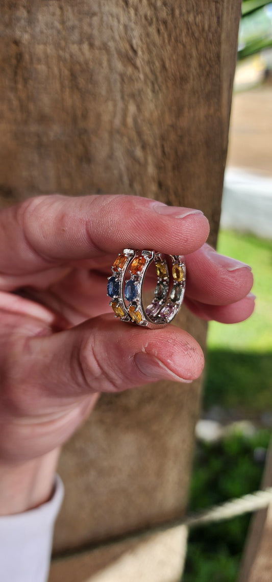 Gorgeous pair of Sterling Silver and multicolor Sapphire Gemstones Huggies/Hoop earrings .Each earring set with 6x Oval Faceted Cut Sapphires.